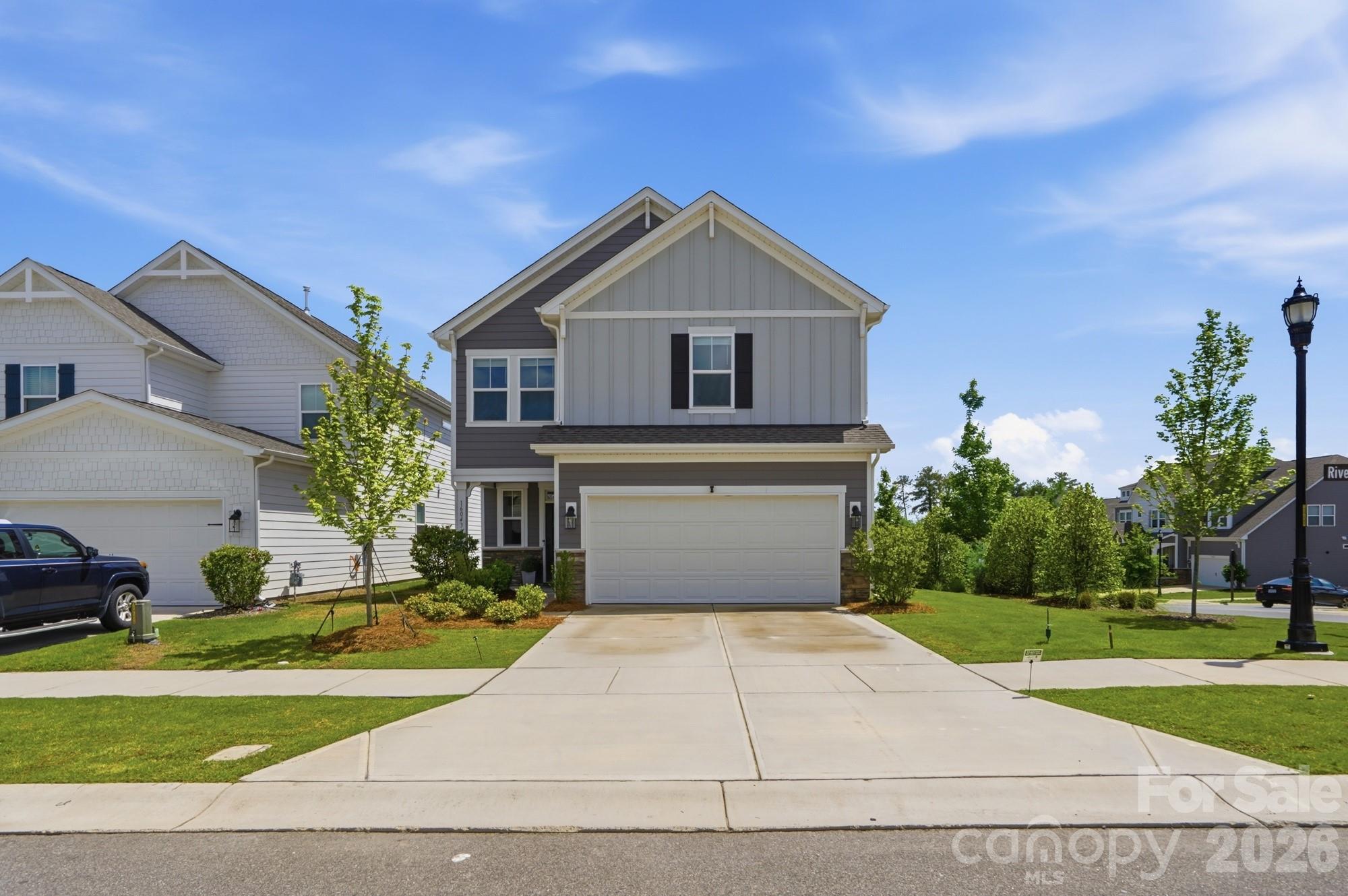 Welcome home to this stunning 2024-built, two-story masterpiece perfectly positioned on a coveted corner lot. From the moment you arrive, the impressive curb appeal and thoughtful architectural details set the tone for what awaits inside.  Step through the front door and be greeted by a bright, open-concept main level adorned with rich engineered hardwood floors that flow seamlessly throughout every living space. Natural light pours in from every angle, highlighting the impeccable craftsmanship and designer finishes that define this home.  The chef-inspired kitchen is a true showpiece, featuring gleaming granite countertops, premium cabinetry, and a generous island perfect for entertaining or everyday family life. Every bathroom in the home echoes this same refined touch, each outfitted with matching granite countertops and high-end fixtures that bring a spa-like feel to the daily routine.  With five spacious bedrooms, there's room for everyone whether you need a dedicated home office, a guest suite, or space for a growing family. Retreat to the luxurious primary suite on the second floor, a true sanctuary offering the perfect separation from the rest of the home. The generous layout and premium finishes make it a space you'll never want to leave.  Located just minutes from the tranquil shores of Lake Wylie, SC, this home places outdoor adventure right at your doorstep. Daily conveniences are equally effortless Rivergate Shopping Center is nearby, premier outlet shopping is just a short drive away, and seamless access to major interstates means commuting to Charlotte or reaching Charlotte Douglas International Airport is a breeze.  Like new, move-in ready, and loaded with upgrades such as a 5.1 surround sound system with ceiling speakers in the living room, prewiring for vanity lights in every bathroom and a tankless water heater this is the home you've been waiting for.  The HOA also includes a social and tennis membership for the Palisades Country Club.  Schedule your private tour today before this rare opportunity is gone.