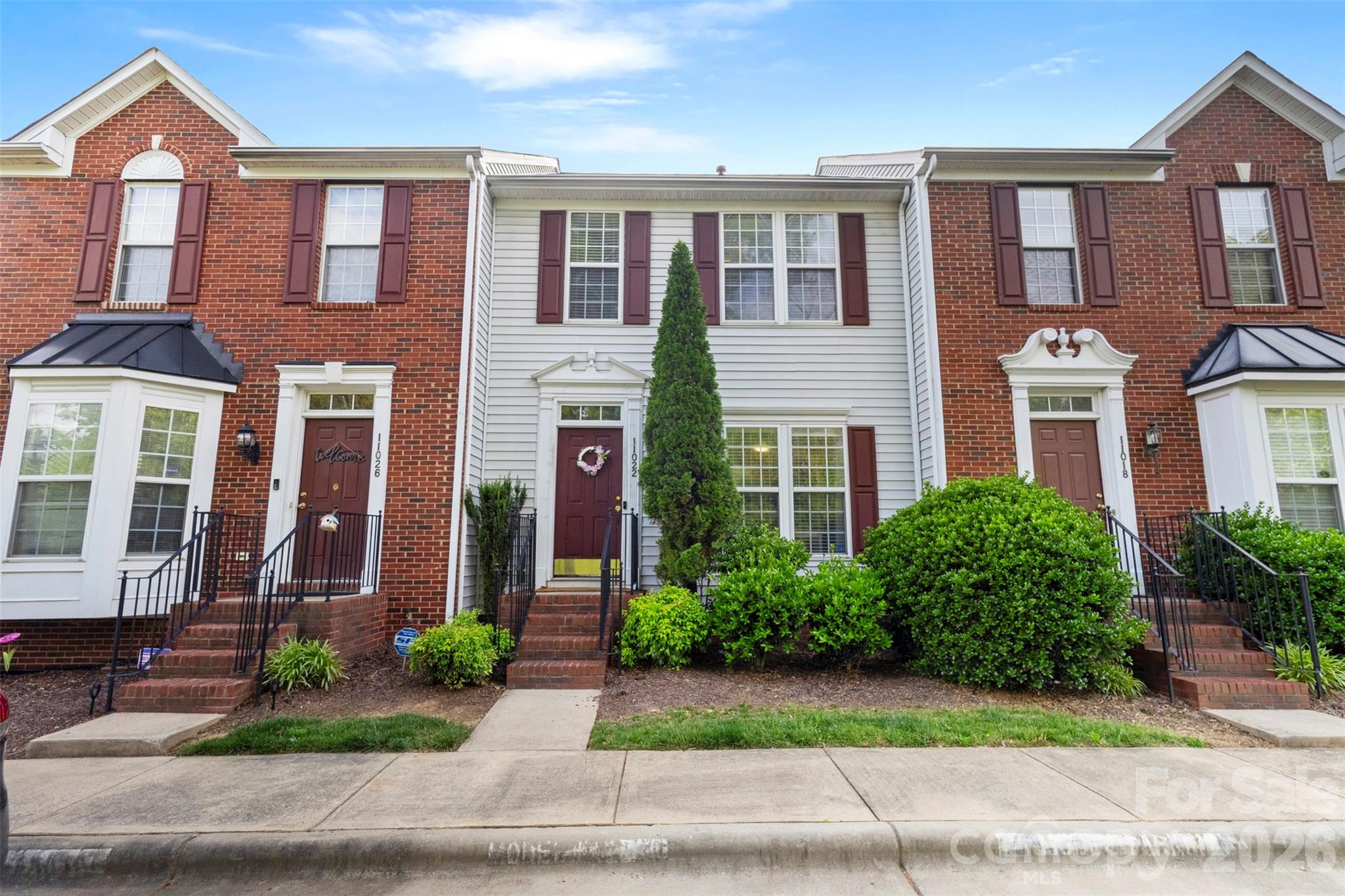 Welcome to this charming and spacious townhome offering comfort, style, and flexibility throughout all three levels. Featuring durable laminate flooring across both the main and upper levels, this well-maintained home combines modern touches with functional living spaces. All within a short drive to 485 and I-77. Just about 14 mile drive to Uptown Charlotte. 

The main level welcomes you with an open living area and kitchen layout, perfect for everyday living and entertaining, along with access to a deck ideal for relaxing or enjoying outdoor gatherings.

Upstairs, you’ll find the primary suite and an additional guest bedroom, each with its own private full bathroom, providing comfort and privacy for family or visitors.

The fully finished basement adds incredible versatility with two additional bedrooms, a full bathroom, and flexible living space that can easily serve as a home office, gym, media room, or guest retreat. With direct access to the fenced backyard, the lower level offers endless possibilities to fit your lifestyle needs.