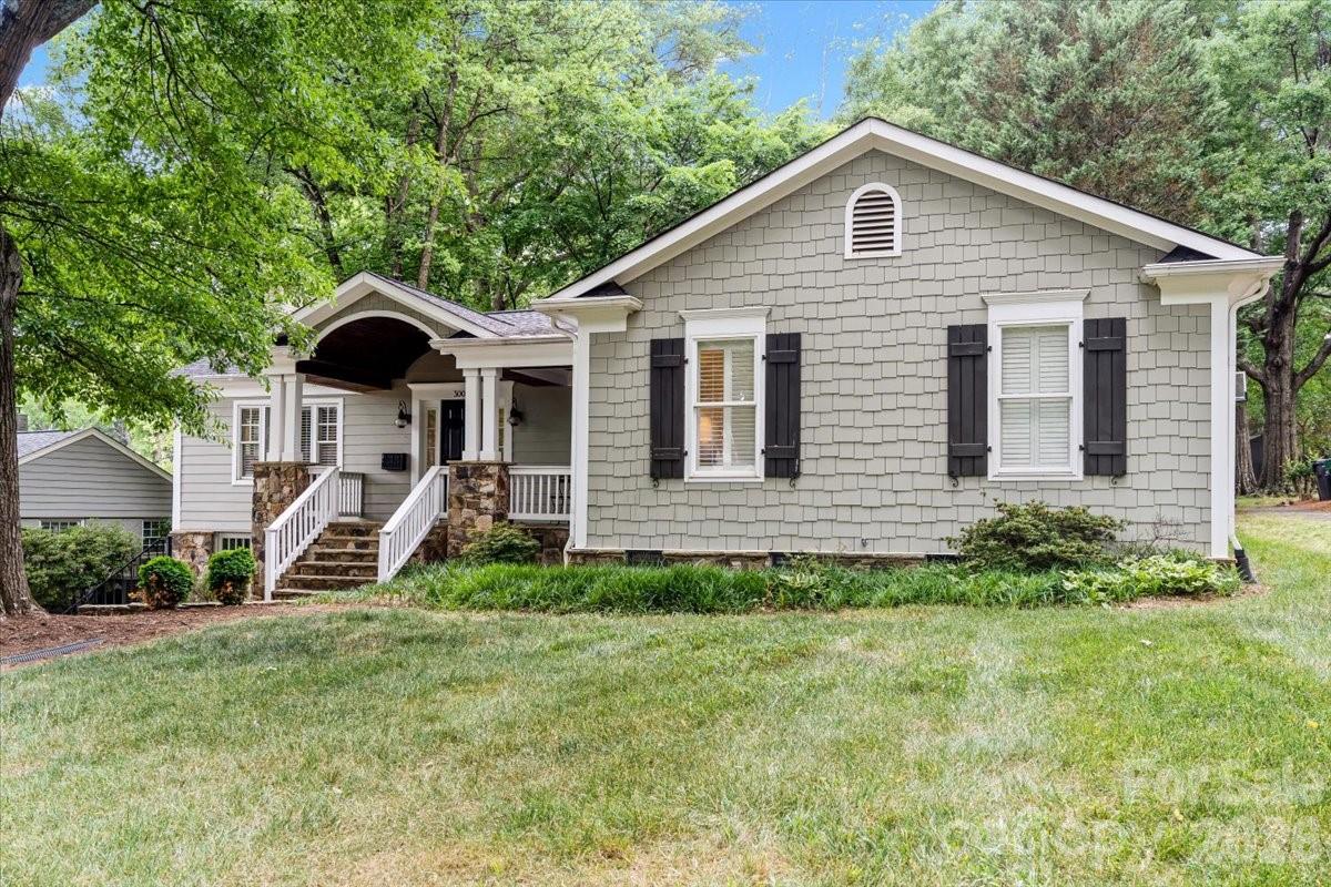 Tucked away in the coveted Myers Park / Freedom Park area, this storybook cottage seamlessly blends timeless charm with refined, modern living in one of Charlotte’s most desirable locations! Situated just moments from Uptown, premier medical centers, and the vibrant energy of Dilworth, South End and SouthPark, this home also offers exceptional accessibility to boutique shopping, acclaimed dining, the Greenway and Freedom Park. A welcoming covered rocking chair porch sets the tone, opening into an airy, open-concept interior defined by rich hardwood flooring and effortless flow. The thoughtfully designed kitchen is both functional and beautiful, featuring a farmhouse sink, stainless steel appliances, abundant cabinetry, generous prep space and a walk-in pantry — seamlessly connecting to the main living areas and a screened porch ideal for year-round entertaining. The private primary suite is a true retreat, complete with vaulted ceilings, a custom walk-in closet, and a spa-inspired bath featuring a soaking tub, oversized walk-in shower, and direct access to the front porch — the perfect spot for quiet mornings. Three additional generously sized, light-filled bedrooms offer both space and privacy, sharing a well-appointed modern bath. Outdoors, a fenced backyard creates a serene setting for relaxation or gathering, while the unfinished basement provides exceptional flexibility for storage or future customization. A newly replaced roof in 2024 rounds out this elevated, move-in-ready home in an unbeatable location.