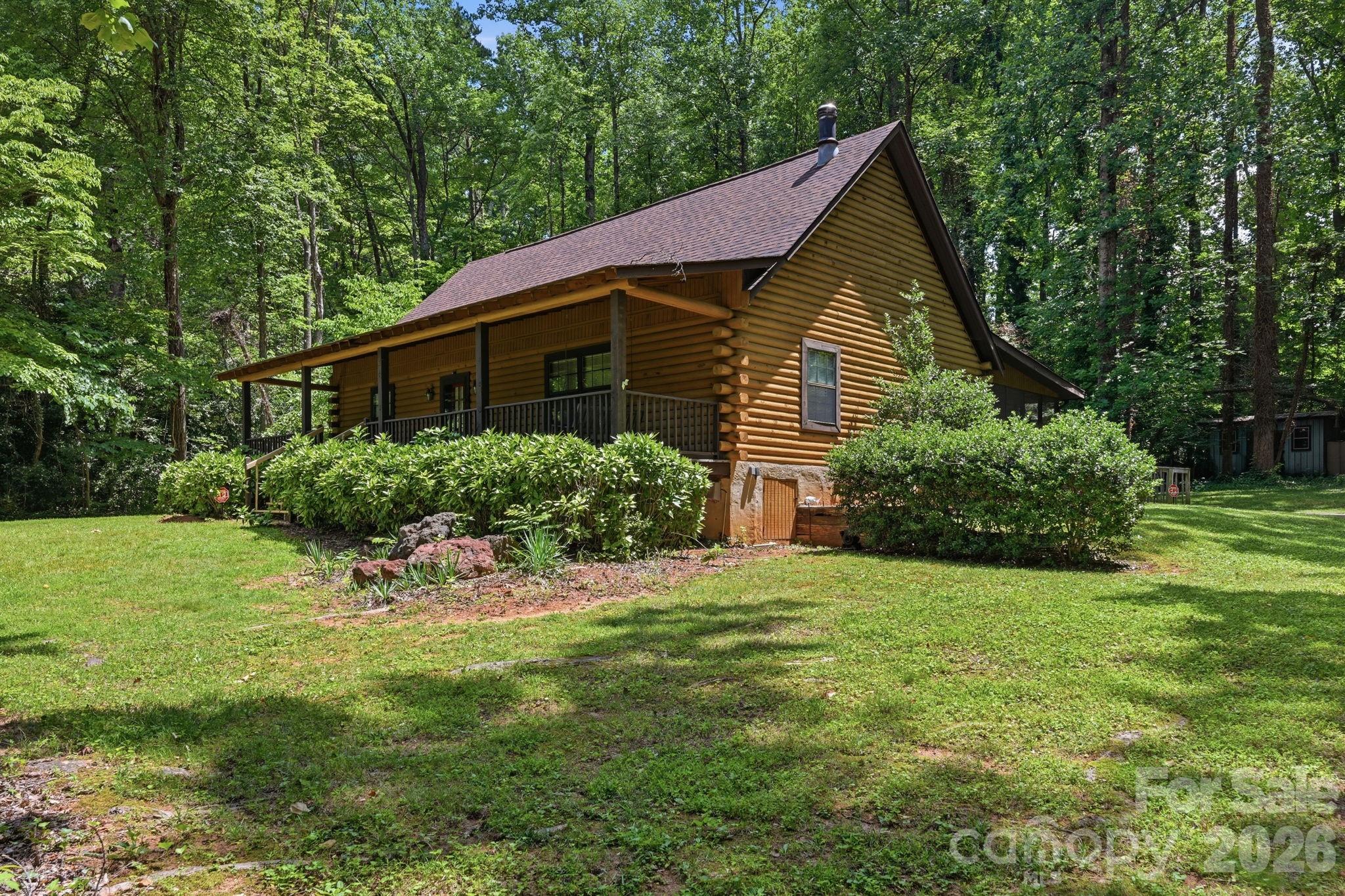 Welcome to your private Charlotte retreat! Nestled on a sprawling 1.5-acre lot surrounded by peaceful wooded views, this charming log cabin home offers the perfect blend of rustic character and modern comfort. Featuring over 1900 square feet of living space, with three bedrooms plus a large loft area, the home welcomes you with a large covered front porch—an ideal spot to enjoy your morning coffee or unwind in the evening. Inside, you'll find warm wood finishes and inviting living spaces designed for comfortable everyday living. Step outside to the rear screened porch and enjoy the tranquility of nature without leaving home. The expansive lot provides exceptional privacy, room for outdoor activities, gardening, or future expansion. Two outbuildings and carport included in sale as well as refrigerator, washer and dryer. Original owner! A unique bonus for investors and future-minded buyers: according to the zoning department, the property may be eligible for subdivision, offering outstanding potential for adding value.
The seller is offering this home "as-is"