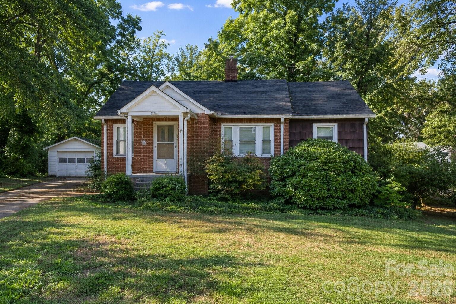 Charming and full of character, this well-maintained brick home sits on a picturesque 0.66-acre lot with a peaceful creek running through the property. Offering timeless appeal and move-in-ready comfort, this home features beautiful original hardwood floors, classic archways, and abundant natural light throughout.
The inviting living room is highlighted by a cozy fireplace and large windows that create a warm and welcoming atmosphere. A formal dining room provides the perfect space for entertaining, while the kitchen offers ample cabinet storage, a breakfast area, and convenient access to the home's living spaces. With two spacious bedrooms, one full bath, and a basement offering additional storage or workshop potential, this home combines functionality with charm. Walk-up attic access provides even more storage possibilities. Step outside and enjoy the expansive yard, mature surroundings, and tranquil creekside setting that make this property truly special. Conveniently located with easy access to Newton, Hickory, shopping, dining, and major commuter routes, this property offers the perfect blend of country charm and everyday convenience.