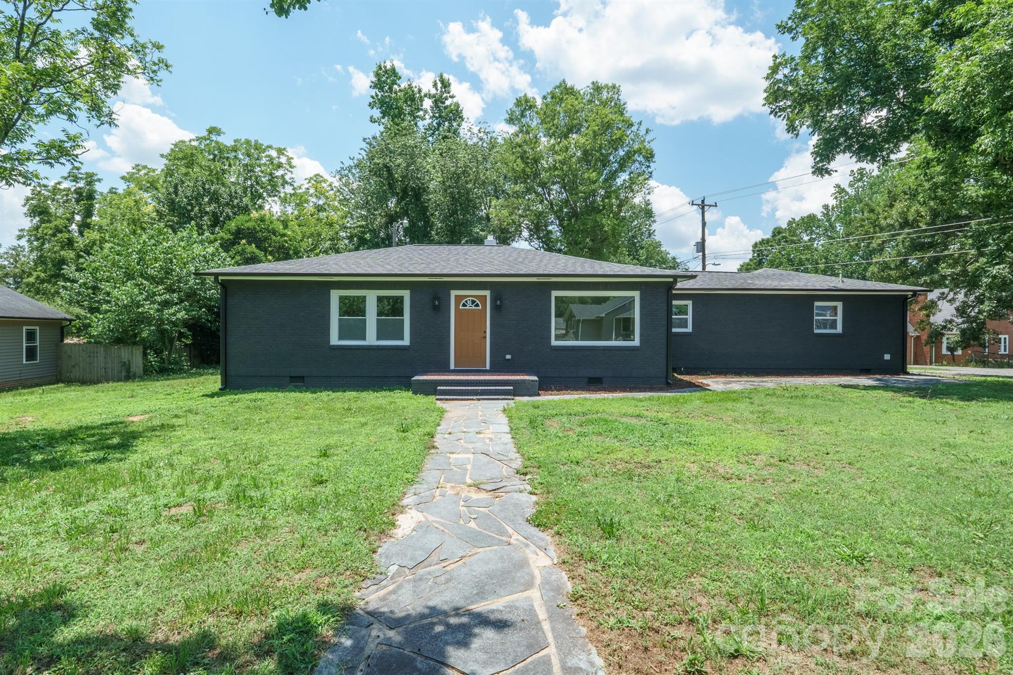 Welcome Home to this fully renovated all brick ranch only 2 miles from downtown Kannapolis. If you are looking for an updated 3 bedroom, 2 full bathroom home with gorgeous finishes, this is your next home.  The kitchen has beautiful granite countertops, stainless steel appliances and a functional island with easy access to the large covered rear porch, perfect for all of your entertaining needs.  The expansive laundry room has extra storage space and a great pantry with shelving.  Both spacious bathrooms feature vessel sinks, granite countertops, stunning tile tub surrounds and flooring.  New plumbing, electrical and hvac with new duct work. New gutters/downspouts, windows, garage door & opener, exterior doors, drywall, paint (interior & exterior), vinyl plank flooring, tile in laundry and bathrooms, appliances, water heater and privacy fence. Two large storage sheds in rear yard will convey.  All permits were pulled with Cabarrus County for the renovations.