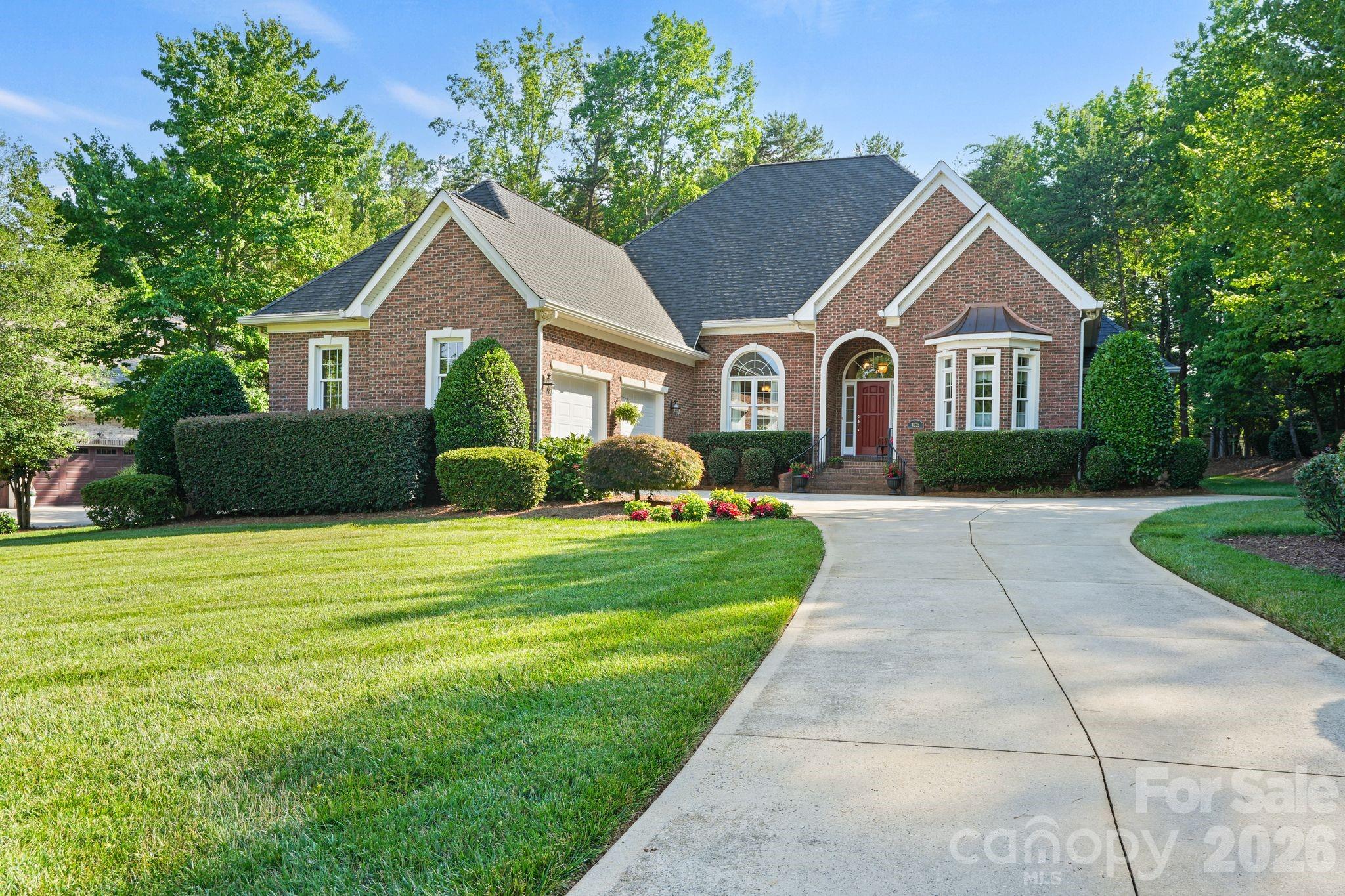 Rare opportunity to own this beautifully maintained custom full brick home in desirable Sailview with a private deeded boat slip on Lake Norman. A path just beyond the backyard provides direct access to the private deeded boat slip. Designed for comfortable main-level living, this home features the primary suite, two additional bedrooms, private office with French doors, formal dining room, spacious great room with gas fireplace and built-ins, keeping room, and an expansive kitchen all on the main level. Gleaming hardwood floors extend throughout much of the main level, complemented by thoughtfully designed pocket doors that reflect the home's quality craftsmanship and attention to detail. Upstairs offers a private 819-square-foot retreat featuring a fourth bedroom or bonus room, full bath, and an enormous walk-in attic providing exceptional storage and future expansion possibilities. The oversized two-car garage offers exceptional flexibility, with an additional storage area comparable in size to a third bay, making it perfect for a workshop, golf cart, bikes, lawn equipment, or abundant storage. Enjoy the screened porch and oversized deck overlooking the beautifully landscaped backyard. Whole-house generator included. Sailview offers exceptional amenities including a clubhouse, pool, tennis courts, pickleball, volleyball, and playground. Desirable Denver location with convenient access to Charlotte Douglas International Airport, Uptown Charlotte, shopping, dining, and top-rated schools.