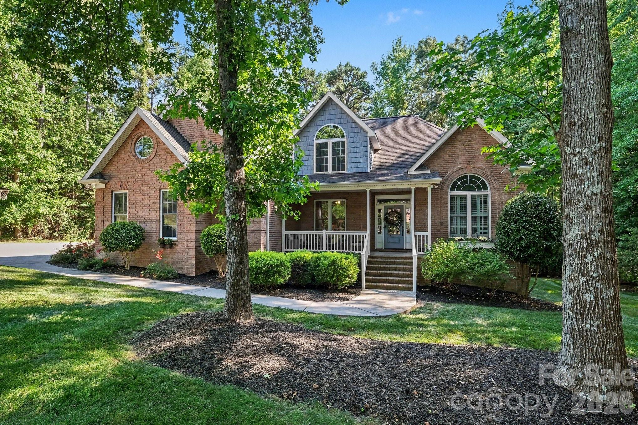Charming **FULLY FURNISHED** custom all-brick Locust home on 1.13 acres in the desirable Hickory Ridge neighborhood.  Interior boasts many features including 4 bedrooms, 3 full baths, vaulted ceilings in living room with rock fireplace (gas logs), built-in bookshelves, 2 car attached garage.  Exterior features a large lot, wonderfully landscaped, lots of shade trees, private backyard setting with deck and inground pool for relaxing in the evening or entertaining family and friends.  Convenient to Charlotte, Concord, and Monroe.