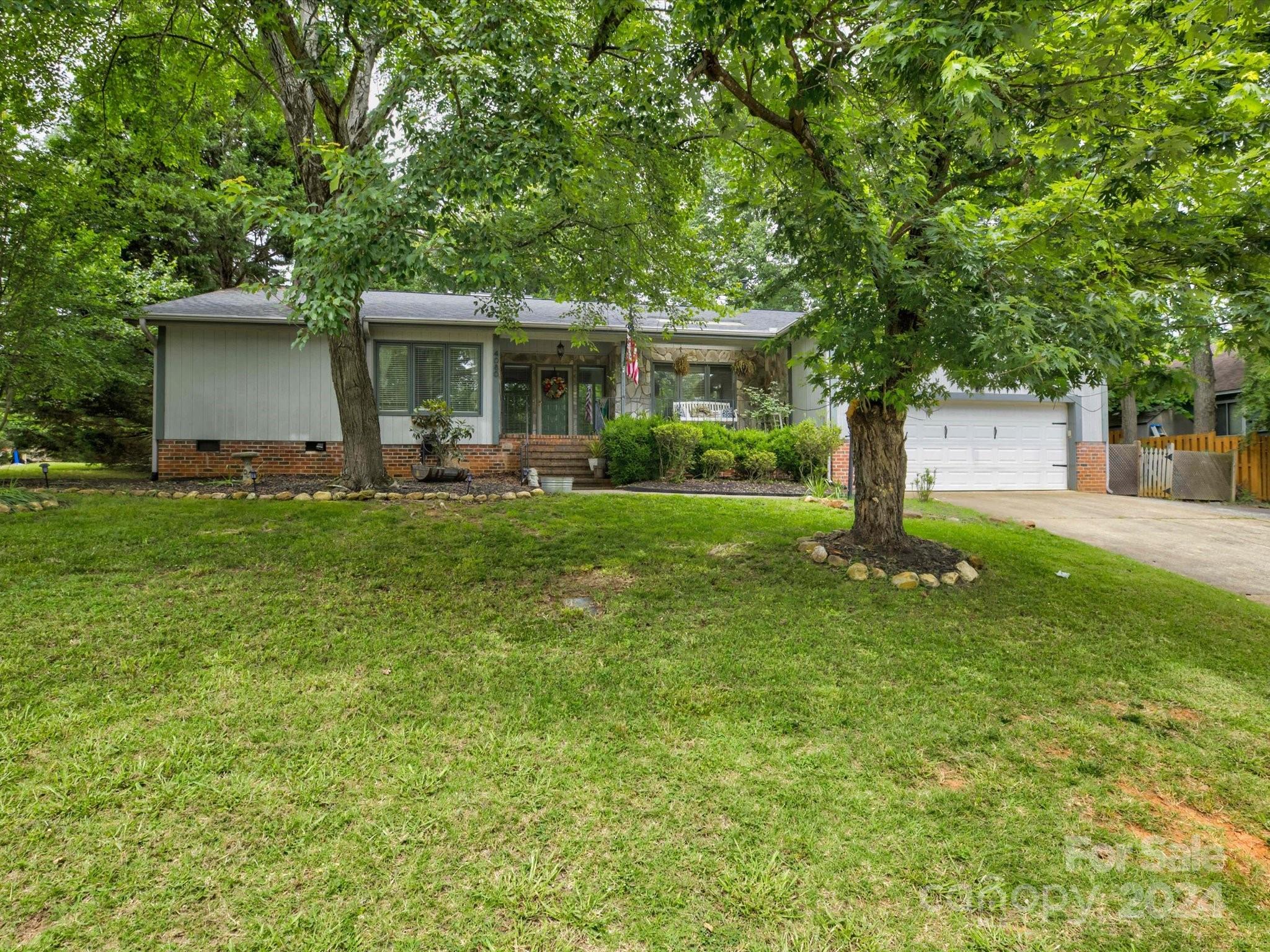 NEW and Improved price on this Sprawling RANCH in Tega Cay with access to highly sought after schools and NO HOA! The new homeowners will have the PEACE OF MIND knowing that the roof was replaced 3 years ago AND the Crawl Space was cleaned up and ENCAPSULATED with a sump pump AND a dehumidifier added! (The crawl space has a transferrable warranty with Dry Pro good until 2026!) NEW Hot Water Heater in 2022 and new Kitchen Appliances in the last year or two! No worries! The 4th bedroom makes the perfect SECOND PRIMARY Bedroom with an en-suite bathroom! Updated kitchen with quartz counters and ceramic backsplash and stainless appliances. The Great Room features stunning vaulted ceilings and a stone fireplace! Flooring was newly installed roughly 3 years ago. The level back yard has a lovely deck and is fenced in. Monthly termite treatment and Bond through Sage Pest Control. Close to parks, golfing, recreation and Lake Wylie!