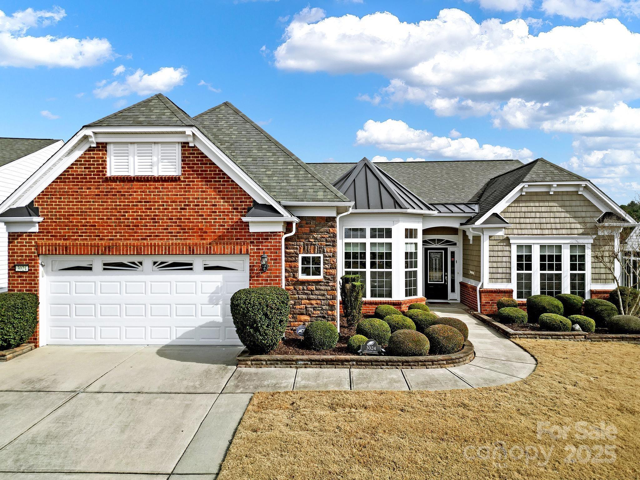 Stunning Move-in ready Cumberland Hall w/3-season room overlooking private wooded view! Open & entertaining chef's kitchen features granite counter tops, SS appliances, gas cooktop w/vent hood, wall oven, long center island, & a sunny breakfast nook! Cozy up to the gas-log fireplace in the great room during cooler months & enjoy the beautiful views from the 3-season room w/tile floor & ceiling fans for added comfort on warm days! Spacious primary suite offers a tray ceiling & ensuite bath w/dual sink vanity, glass shower, & custom walk-in closet! Two generous guest bedrooms w/Jack-and-Jill bathroom are perfect for overnight guests. Office/den with French doors sits at the front of the home - ideal for a home library, office or hobby room! Custom paver patio, new HVAC 2024, hot water heater 2022, epoxy garage floor & built-in storage! Don't miss Sun City's golf course, resort style amenities, social clubs, & more. Just minutes to dining, shopping, & entertainment, plus low SC Taxes!