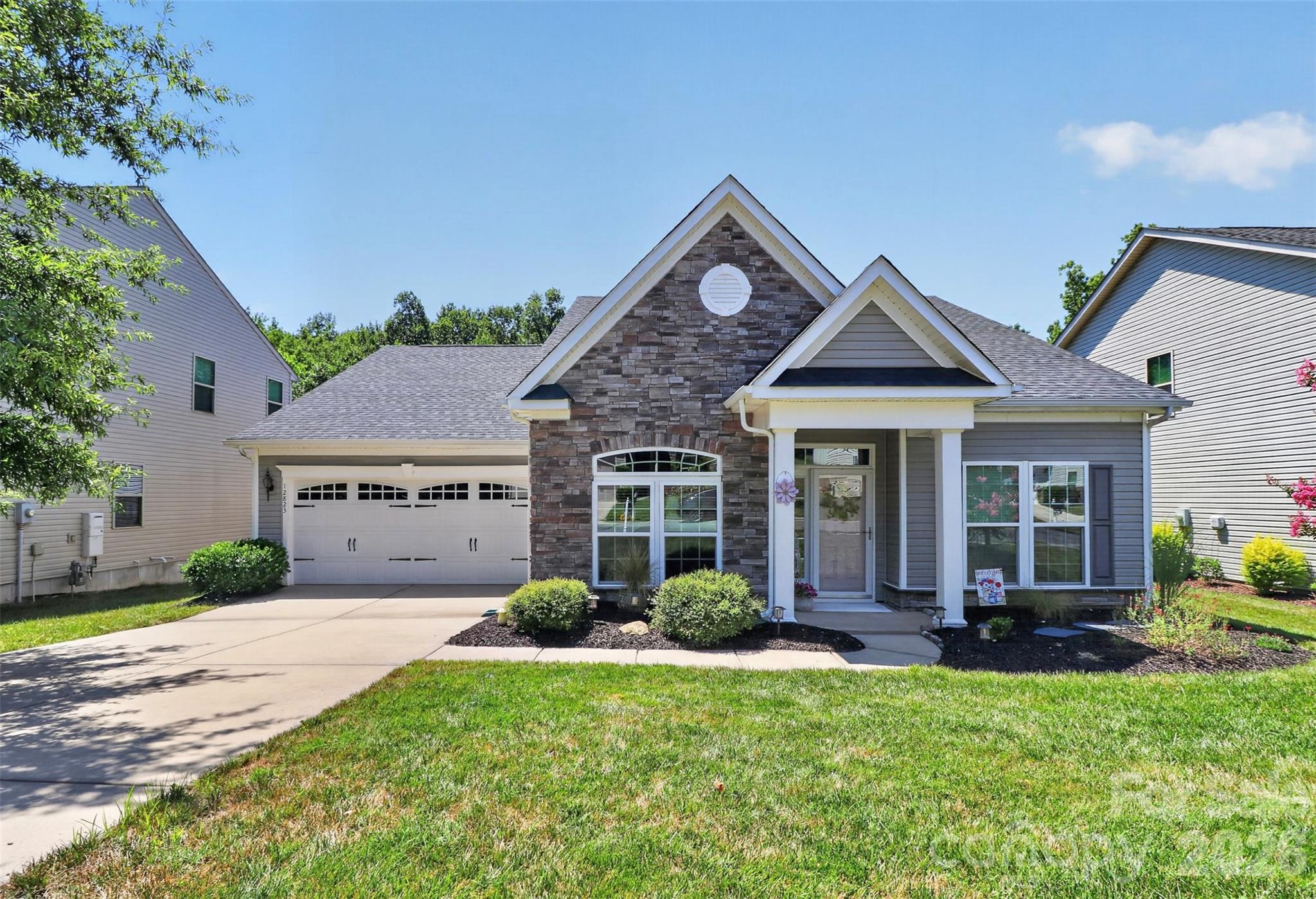 This home is immaculate.  Gorgeous 3-bedroom one story ranch. The home welcomes you the moment you pull up into the driveway.  Beautifully landscaped and exterior elevation. Once entering this open floor plan home that features an amazing kitchen with tons of 42' cabinets, large island, granite, backsplash and gas cooktop. Large great room with gas fireplace, breakfast area and dining area/sitting room.  Large primary bedroom with 2 closets. Primary bath with his and her sinks, huge shower and private toilet area. Laundry room with washer and dryer that convey.  Mud area. The backyard is unbelievable. Its large private with view of woods. Enjoy siting under the metal roof on custom designed pergola with decorative lights. Oversized 2 car attached garage. Cul-de-sac street.  Community features an outdoor pool, club house, recreation area, playground, tennis courts. pickleball and fitness center.