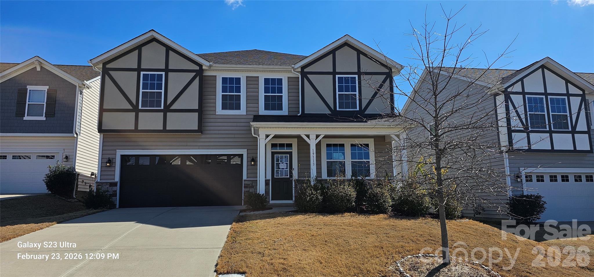 Welcome to this beautifully designed, move-in ready home in one of Charlotte’s most desirable and rapidly growing areas! From the moment you arrive, the charming Tudor-style accents, covered front porch, and inviting curb appeal create a lasting first impression.

Inside, you’ll find a bright, open floorplan thoughtfully designed for both everyday living and effortless entertaining. The main level features durable luxury vinyl plank flooring, abundant natural light, and a seamless flow between spaces. A versatile front room with tray ceiling offers the perfect flex space for a formal dining room, home office, or sitting area.

The heart of the home is the stunning kitchen, complete with a large center island, granite countertops, white cabinetry, stainless steel appliances, gas range, and stylish pendant lighting. Overlooking the spacious living room with cozy fireplace, this layout is ideal for gatherings or relaxing evenings at home. A built-in drop zone/butler’s area adds both functionality and extra storage.

Upstairs, a generously sized loft provides a second living area perfect for a media room, playroom, or workspace. The spacious primary suite offers a true retreat with tray ceiling, abundant natural light, and a well-appointed en-suite bath featuring dual vanities, tile flooring, a glass-enclosed shower, and separate soaking tub. Secondary bedrooms are well-sized and versatile, and the conveniently located upstairs laundry room adds everyday ease.

Step outside to a flat, usable backyard with patio and privacy fencing—perfect for entertaining, relaxing, or enjoying outdoor living.

Located in a well-maintained community with sidewalks and a welcoming neighborhood feel, this home offers convenient access to shopping, dining, major highways, and everything the Charlotte area has to offer.

If you’ve been searching for a home that combines modern style, functional space, and move-in ready convenience—this is it.