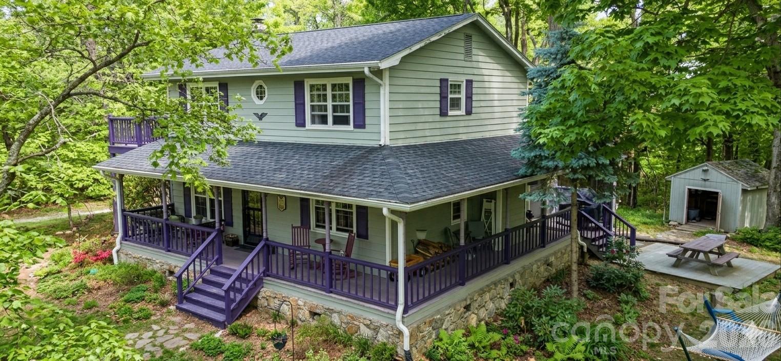 Welcome to Lavender Hill, a charming 2-story mountain home located on a spacious 12-acre lot. It offers a variety of amenities and unique features that make it a truly special place to live.
The 2008 sq/ft home features 3 bedrooms and 3 bathrooms, a bonus room, offering ample space for a family or guests. One of the highlights of this property is the stunning views it offers. With 360-degree winter views that extend for 30-40 miles, you'll feel like you're living on top of the world.
Inside, the home is filled with character and warmth. The heart pine floors throughout add a touch of rustic elegance. The living room features a woodburning fireplace, perfect for cozying up on cold winter nights. The kitchen is equipped with both a propane stove and a wood burning cooking stove, giving you plenty of options for preparing meals.
The outdoor space is just as impressive. The wrap around porch and screened in side porch offer the perfect spot to relax and enjoy the fresh mountain air. The 12-acre lot is mostly wooded, but also features herb gardens, fruit trees, and berries. For those interested in self-sufficiency, there's also a greenhouse and a chicken coop.
In addition to the main house, there's also a detached garage/workshop with an upstairs studio. The workshop even has a woodstove, making it a comfortable place to work year-round.
Lavender Hill offers the perfect balance of privacy and convenience. Located just 15 miles from Black Mountain and 13 miles from Lake Lure, you're close to all the amenities these charming towns have to offer.
Whether you're looking for a private retreat, a place to start a homestead, or an investment property for a bed and breakfast or Air BNB, Lavender Hill is a must-see. With a new heat pump, well head and piping, fully encapsulated crawl space, roof, and a whole house generator, this home is ready for you to move in and start enjoying.