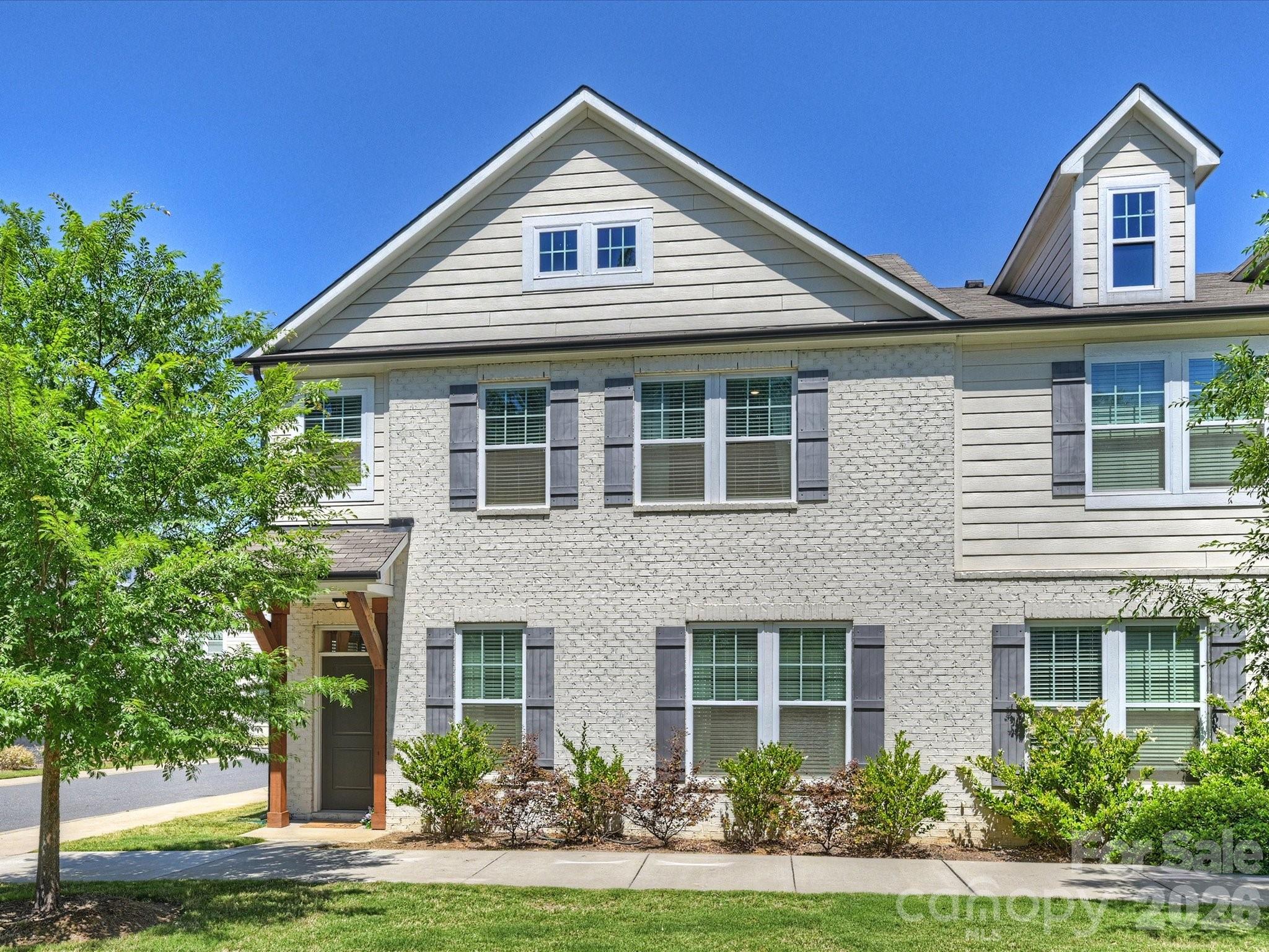 Welcome to easy living in the heart of charming downtown Pineville! This beautifully maintained corner-unit townhome offers the perfect blend of low-maintenance convenience and downtown lifestyle living. Located right next to Pineville’s popular local restaurants, coffee shops, boutiques, parks, and everyday conveniences, you’ll love being able to enjoy one of the area’s most charming downtown districts right outside your door.

Inside, the home is filled with natural light thanks to its desirable corner location and abundance of windows. The spacious open-concept main living area seamlessly connects the living room, dining space, and kitchen—creating an airy and inviting layout perfect for entertaining or everyday living. Upstairs, you’ll find 3 generously sized bedrooms plus a versatile loft space ideal for a home office, media room, workout area, or additional lounge space.

Meticulously cared for and truly move-in ready, this home offers a “lock-and-leave” lifestyle with minimal upkeep and no yard maintenance to worry about. A rare 2-car garage provides excellent storage and convenience. Whether you're looking for simplicity, convenience, or a stylish low-maintenance home in a prime location, this Pineville gem checks all the boxes!