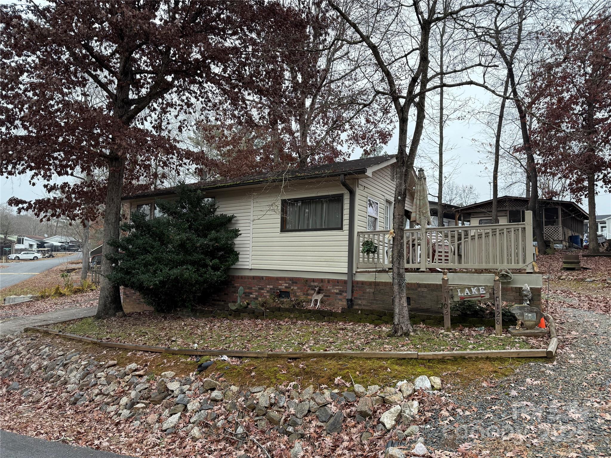 Welcome to your "Lake Cottage" here in the park. This 1 bedroom and 1 bath unit is full of colors and fun. It comes fully furnished and ready for her new owner's. Large living room, flex space right at the door. Nice size dining area. Front end kitchen gives more space in kitchen, counters and cabinets. Good storage in camper. Some concrete, metal carport, 2 storage buildings. The lot is an interesting shape. All buyers must be with a realtor to gain entry to the community. Come and see if this could be your "Happy Place" here in Twin Harbor. No title, Bill of Sale will be provided.