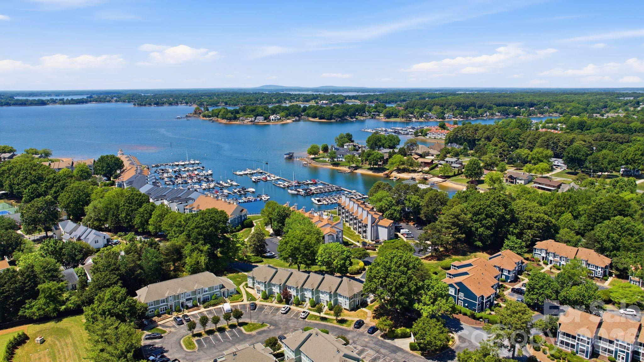 $$$ - $5,000 SELLER CONCESSIONS TO USE HOW YOU PLEASE and 1 YEAR HOME WARRANTY Welcome to the desirable Vineyard Point Bayview condo community in the thriving Lake Norman town of Cornelius! This light-filled condo offers an inviting coastal lake vibe with soaring ceilings, an open-concept layout, and a spacious living area perfect for relaxing or entertaining. The large screened-in porch feels like an extension of the living space, creating the ideal spot for morning coffee, evening unwinding, or enjoying seasonal water views — with expanded year-round views when the HOA completes seasonal tree trimming. Residents enjoy access to a community pool, scenic lakefront boardwalk, and both community and town sidewalks ideal for walking, biking, and embracing the Lake Norman lifestyle. Community waterside boardwalk, marina with gas docks dry storage, and boat rentals just around the corner. and a Lake Front Restaurant all in walking distance. Spend your evenings strolling along the marina boardwalk, launch the boat for a day on the water, or enjoy the convenience of nearby Morningstar Marina for fueling and lake access. Located just minutes from Birkdale Village, shopping, dining, marinas, and entertainment are all within easy reach. This condo perfectly blends comfort, charm, convenience, and effortless lakeside living.