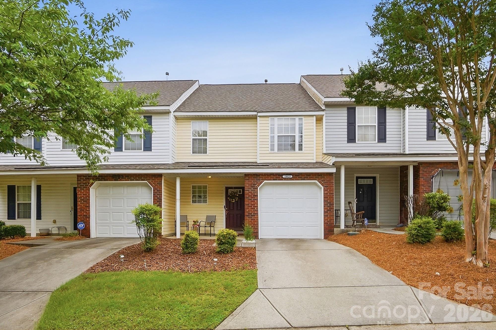 Enjoy low-maintenance living in this thoughtfully appointed three-bedroom townhome, designed to accommodate a variety of lifestyles. Each bedroom features its own private full bath, offering exceptional comfort and flexibility for family members, guests, or roommates.
The heart of the home is the spacious main level, where an open layout seamlessly connects the living, dining, and kitchen areas. The kitchen stands out with expansive granite countertops, a large center island, and ample pantry storage, creating an ideal space for cooking, gathering, and entertaining.
The upper-level bedrooms showcase dramatic vaulted ceilings that enhance the home's airy feel and architectural appeal. 
Step onto the rear patio and unwind while overlooking private backdrop that offers both privacy and a peaceful outdoor setting. Residents also enjoy neighborhood amenities including sidewalks throughout the community, a swimming pool, and a clubhouse for recreation and social gatherings.