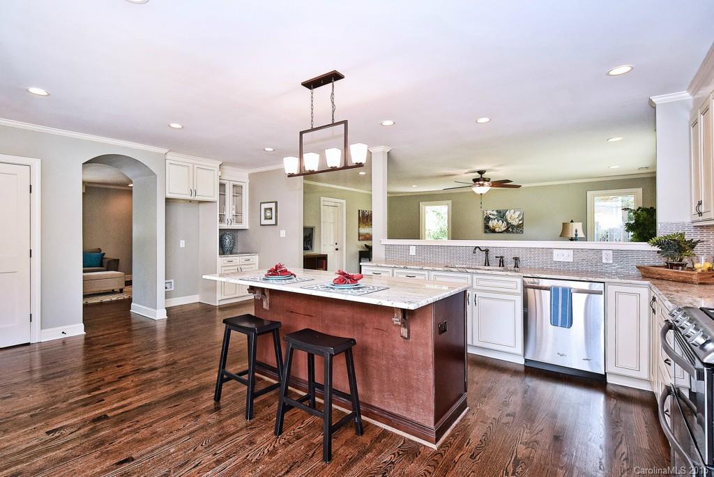 Hard to find completely renovated Ranch style home on a flat large lot with 3 new room additions in 2015.  New room additions are the kitchen, family room, master suite and laundry area.  New electrical, plumbing and new HVAC for the room additions.  Hardwood floors throughout the home and Tile floors in that bathrooms.  Kitchen features custom cabinets, granite Countertops, Tile backsplash and SS appliances, large island with seating for bar-stools. Open kitchen to large family room.