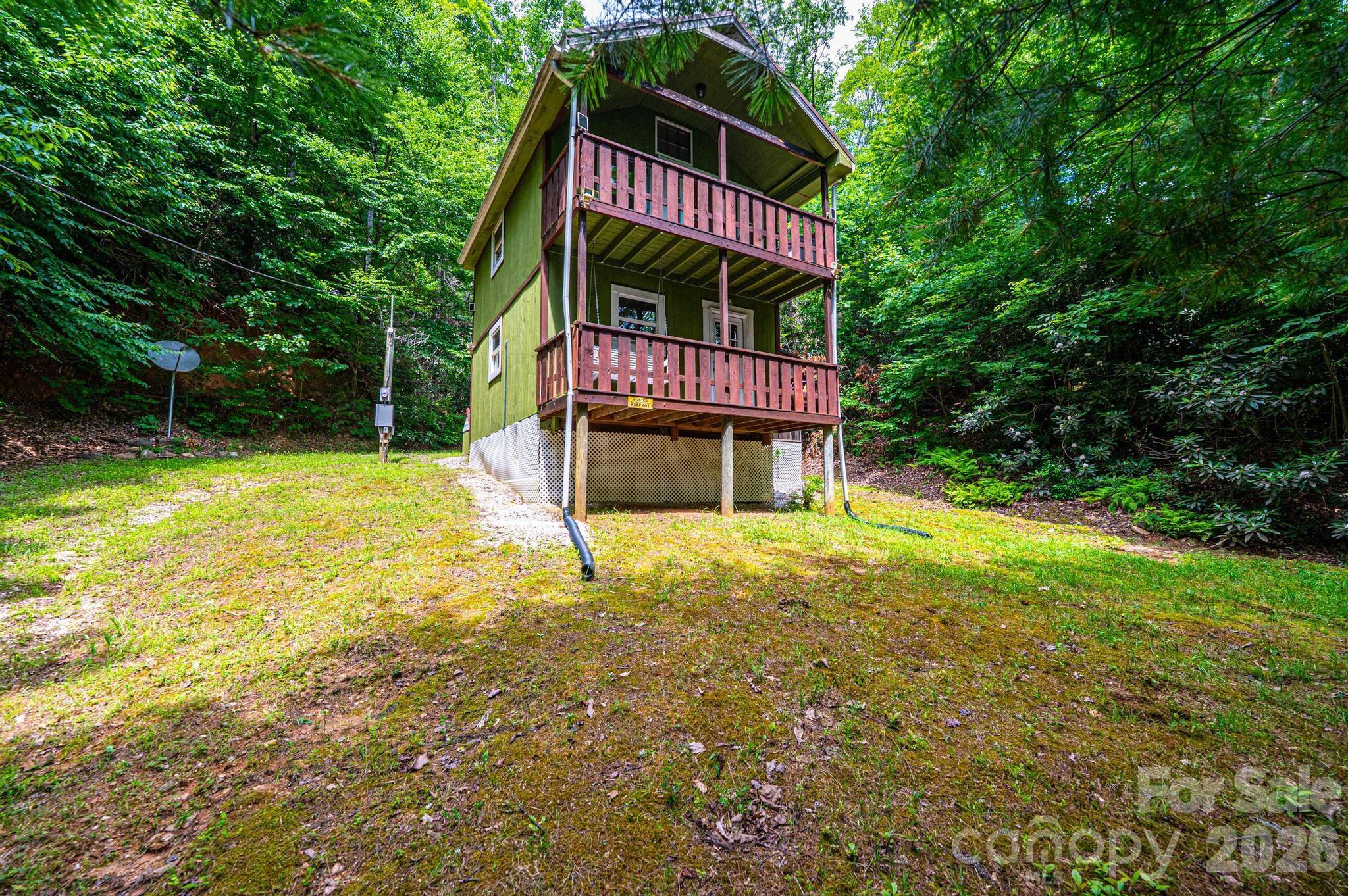 The "Maple Sally Cabin" is waiting for you! The remote "glamping" cabin you have been dreaming of! This property backs up to the National Forest Service land and provides tons of privacy for your weekend getaways. Perfect for the outdoor enthusiast, this cabin is close to mountain biking trails, hiking trails, and some of the best fly fishing spots on Wilson Creek. Or hop in your side-by-side or car and enjoy traveling the gravel back roads of Caldwell County to Blowing Rock for the day. On the main level, you will love the cozy great room with a woodstove to keep you warm, a kitchenette to prepare your catch of the day, a full bath, a front balcony and a 10x10 screened porch. Upstairs can serve as your own private bedroom or as a bunk room with multiple bedding options. A woodstove in the living room can be used to heat the home. Ask your agent for a list of the furnishings that will stay and schedule your showing today to see this best kept secret!