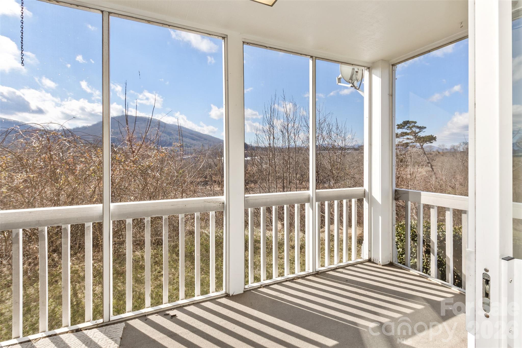 Enjoy mountain views from your screened porch and the ease of true ground-level living in Biltmore Commons. From morning coffee to evening relaxation, the porch offers a comfortable outdoor retreat with a view that adds something special to everyday life.

With step-free access from parking to front door, this well-designed residence combines comfort, convenience, and low-maintenance living. Natural light fills the main living area, while the thoughtful floor plan provides privacy between bedrooms and flexibility for guests, hobbies, or a home office.

Located within Biltmore Commons, a gated community known for its walkability and convenient access to West Asheville, Biltmore Village, downtown Asheville, shopping, dining, and outdoor recreation, this home is well suited for those looking to simplify, right-size, or enjoy a more carefree lifestyle.

If mountain views, easy access, and comfortable living are part of your next chapter, this home is worth a closer look.
