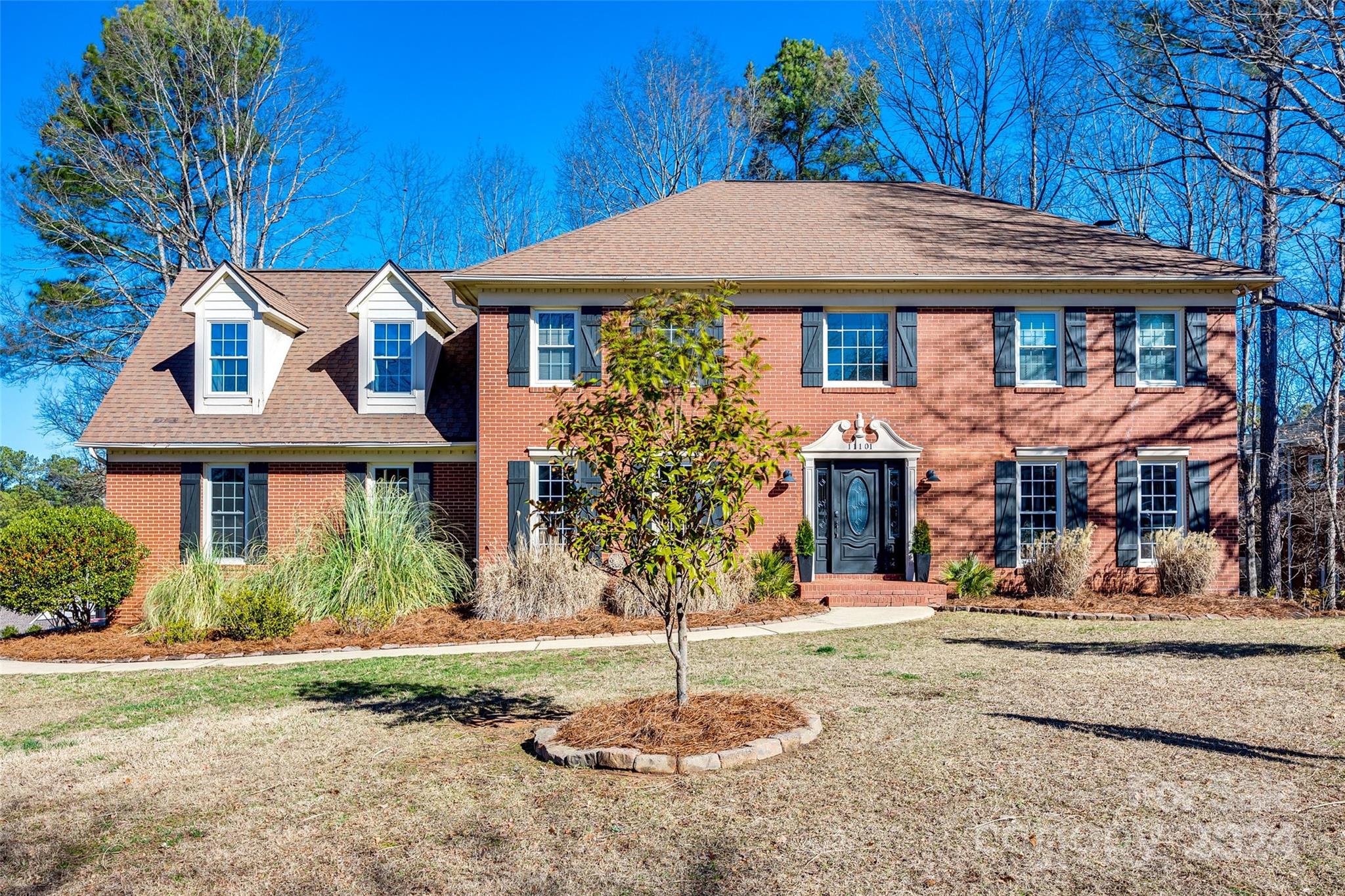 Beautiful full brick home located in the desirable Seven Coves neighborhood in the amenity-rich community of Tega Cay!This home invites you to step inside, with a formal dining room, flex space for a family room or office and an open flow to the kitchen and living room with cozy fireplace. Updated kitchen with new appliances, backsplash, butcherblock countertops & farmhouse sink, hardwood floors throughout, updated lighting fixtures, fans and fresh paint. Step outside to the oversized screened porch and deck that overlooks a private, wooded backyard! Upstairs you will find 4 bdrms and 2 full baths as well as a bonus space that can be used as a loft, office or an entertainers dream.The 2 car garage has polyaspartic floors and built in storage and there is an oversized walk-in crawl space with vapor barrier for all your storage needs.Tankless water heater 2017. The home is convenient to the beach club, lake, walking trails and golf course. Highly rated Fort Mill schools with No HOA dues!