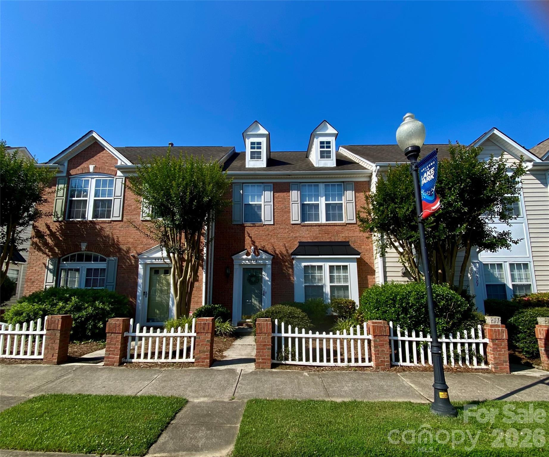Welcome home to The Village of Lake Park. This 2 bedroom, 2 1/2 bath townhome is ready for your buyer. Primary Bedroom w/tray ceiling & ceiling light/fan, walk-in closet, full bath w/a walk-in shower & tile flooring. The secondary Bedroom has a spacious closet and ceiling light fan.  Second floor hallway full bath with shower/tub combo., tile flooring and newly installed Pro-Flo toilet. Living Room leads to the back patio, storage shed & one-car parking pad. Additional parking out back as well as in front. Residents in the community may enjoy a wonderful lifestyle with several amenities nearby including parks, sidewalks, swimming pools, athletic courts, playgrounds, and scenic lakes & ponds. Additionally, the Village of Lake Park is nearby to shops, schools, restaurants, offices, and a community center! Easy access to 74 and I-485 and downtown Matthews. HOA monthly fees also include water/sewer. Pool Membership is available with an additional fee.