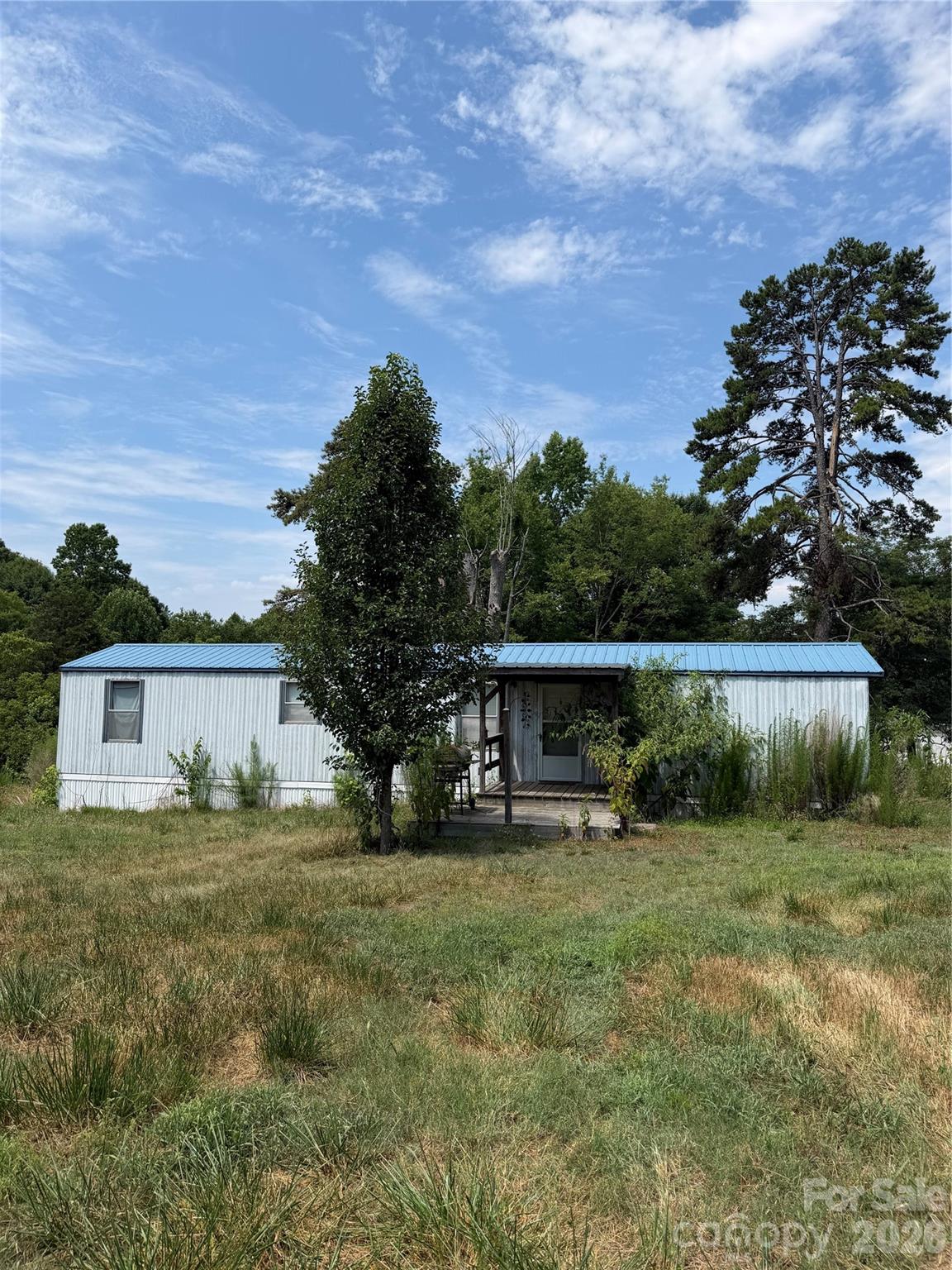 Calling all investors, rehab enthusiasts, and those looking for acreage with potential! Situated on 2.23 acres, this property features a 3-bedroom, 1-bath single-wide manufactured home ready for your vision. Whether you're looking to renovate, invest, or explore the possibilities this property offers, this is an opportunity worth considering. Enjoy the privacy and space of a larger lot while creating something that fits your needs. Property is being sold AS-IS. Buyer to verify all information deemed important, including acreage, utilities, zoning, and intended use.