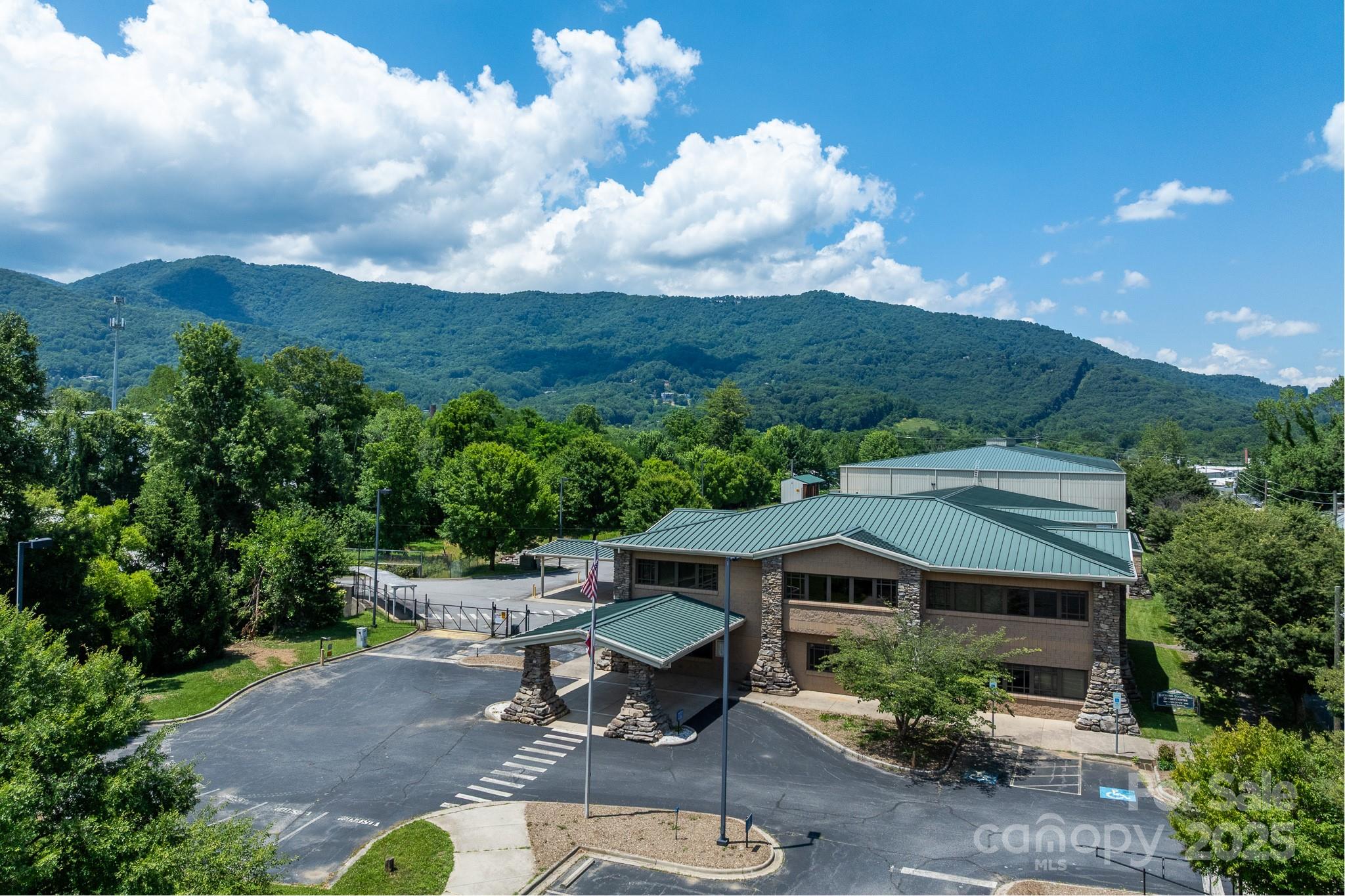Rare turnkey opportunity for clean manufacturing or packaging operations in Western North Carolina.
172 Riverbend Street is a ±66,663 square foot advanced manufacturing and distribution facility on 6 acres in Waynesville, NC—just 30 minutes west of Asheville via I-40 Exit 20. 
Built in 2005, the property is ideally located with easy access to US-276 and US-23/74. The site is zoned and configured to support a wide range of uses, including pharmaceutical production, medical device manufacturing, clean tech, and food and beverage processing.
The facility includes ±27,000 square feet of clean room space, fully conditioned for high-performance operations. The balance of the ±31,200 square foot distribution warehouse is also fully conditioned and served by a wet sprinkler system (no in-rack sprinklers), with ceiling heights ranging from 30 to 35 feet. Three dock-high loading doors with levelers and ±150 parking spaces support efficient logistics and employee access. 
Additionally, there is ±12,322 SF of functional and well-maintained office space with 19 private offices on two floors (elevator access), locker rooms, bathrooms, cafeteria, and lobby. Utilities include 3-phase, 480V power, municipal water and sewer, and flood-proofed construction.
With a versatile layout, clean room capacity, and high-end building systems, 172 Riverbend Street is well-suited for users seeking a turnkey facility in Western North Carolina.

**Disclosure: This property is part of the Benfield Industries Superfund Site and remains under EPA oversight as part of the federal Superfund program. According to the EPA's most recent report (Sept. 2023), the site is considered safe for its current commercial/industrial use. Monitoring systems are installed and remediation efforts are ongoing, with long-term maintenance and land-use controls in place. Detailed documentation, including the latest EPA report, land-use restrictions, and monitoring obligations, is available upon request.