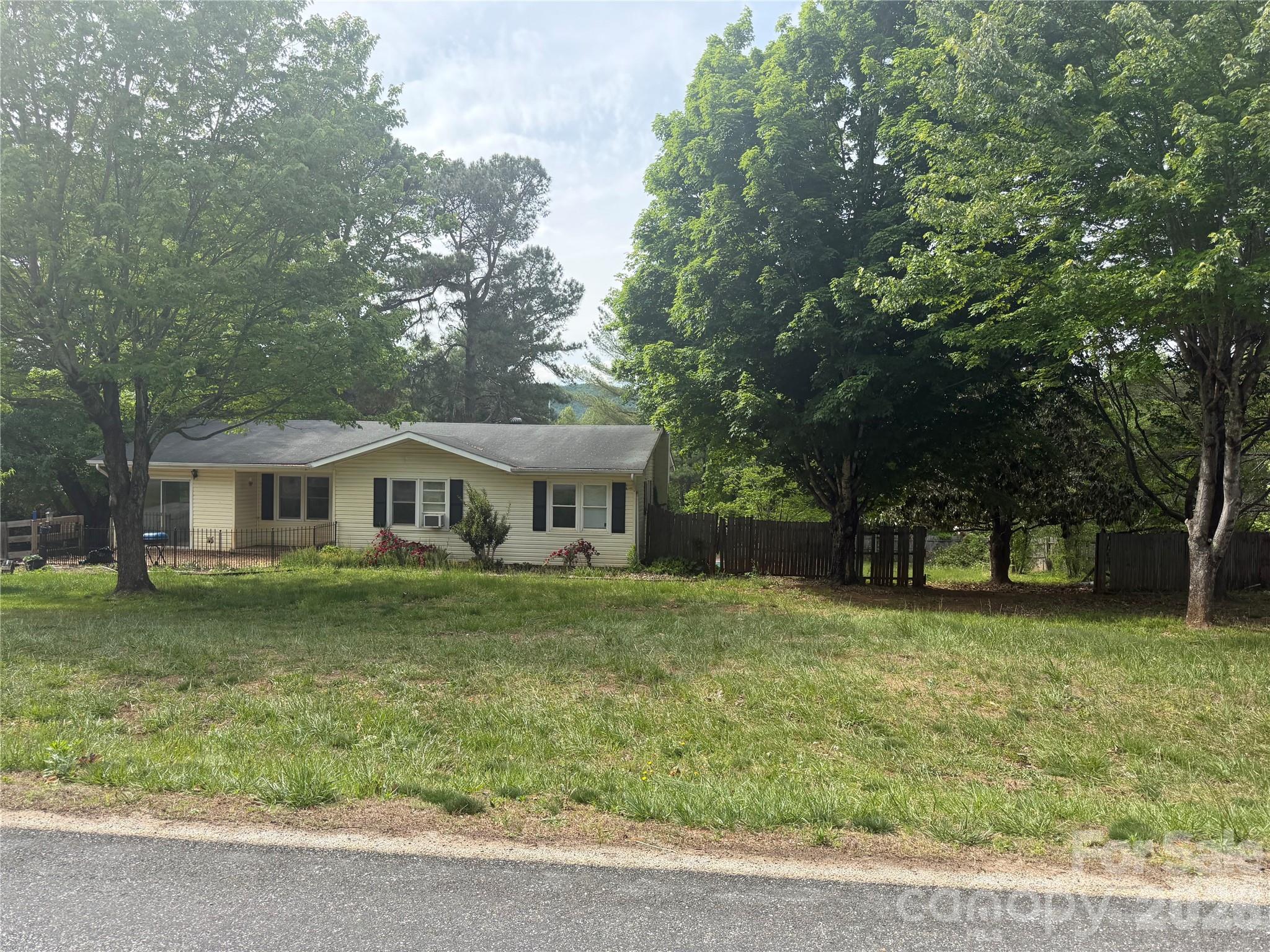Calling all investors, property flippers, and handyman dreamers-this one is bursting with possibility!  Tucked into a  country setting on 1.99+/- acres in Nebo, this 3 bedroom, 2 bath house is waiting for the right visionary to bring it back to life.  In addition to the main floor you have a heated and cooled walk-out basement with a bathroom w-shower and has opportunities limited only by your imagination.  The fenced backyard was once a spectacular entertaining area with an inground pool, water feature, fire pit and dog lot and can be restored again.  Additional features are level yard, gardens pot and large outbuilding.  Property is offered "as is, where is".   The good news is it is already cleaned out, giving you a blank canvas ready for restoration.  Roll up your sleeves and imagine the transformation you could create inside and out.