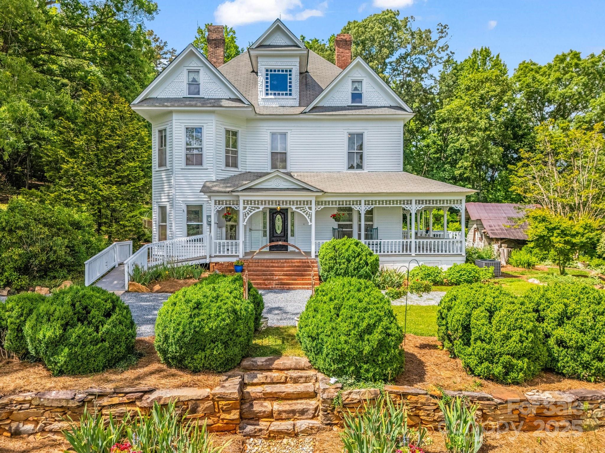 Located only minutes from Rumbling Bald on Lake Lure, this picturesque Victorian style farmhouse sits on over 14 acres which includes multiple building sites, pasture, garden space, green house, and in-ground pool. This unique property is suitable for estate living, farm-to-table restaurant and/or small private inn with some modifications.  The possibilities are endless.  The covered front porch wraps to the side of the house and provides a relaxing area for rocking, enjoying outdoor lunch or sipping tea.  The grounds provide an abundance of opportunities in gardens, lawn games and animal husbandry. Barns and outbuildings could be reimagined as event space, shops, spa space, etc.  A short 4-mile drive to shopping, restaurants and access to Lake Lure.  Airports in Greenville SC, Asheville and Charlotte are all within 1 ½ hours.   As infrastructure is being re-built in Lake Lure, now is a great opportunity to create a lasting legacy.