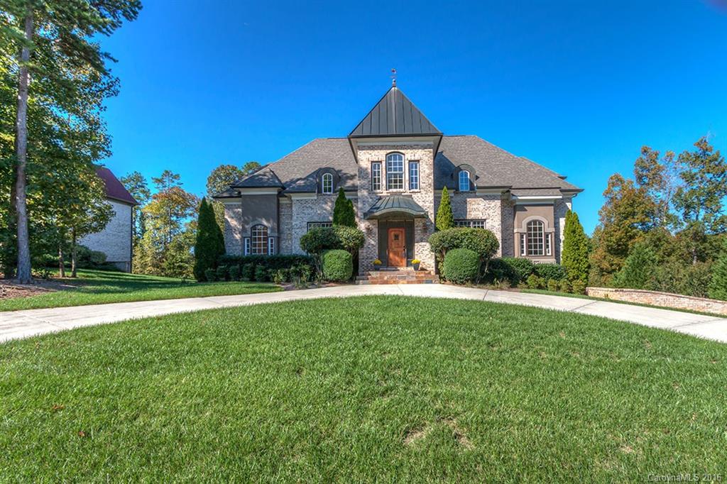 Exquisite custom built home on the 13th hole. Features a personal elevator, movie theater/ticket booth, wet bar, heated tile in BAs, custom cabinets, coffer ceilings, hardwood floors, steam shower, and much more. Private BAs for each BR. 2 master BRs on main level. Gourmet, never been used kitchen, large bonus in basement, great loft on 3rd floor. All new appliances included! Main level patio & basement porch. Community is amenity rich! Social mbmship and golf cart included.  *See agent remarks.