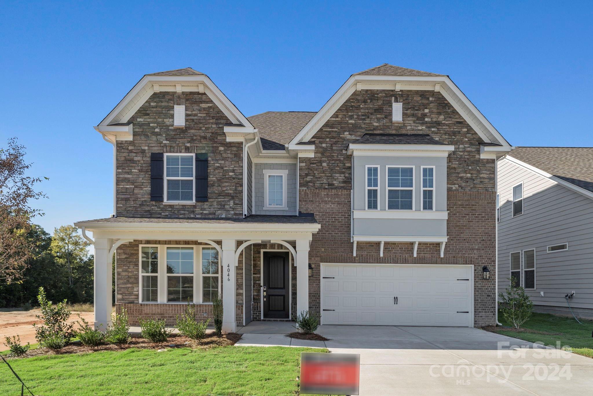 MLS#4167597 Ready Now! The Somerset floor plan in River Falls blends style and flexibility in a welcoming two-story home. The main floor features an open concept gathering room with a gas fireplace, casual dining area, and a kitchen with expansive counter space, an island with a breakfast bar, and a large walk-in pantry. Adjacent to the kitchen is a built-in valet off the garage entry for convenient storage of shoes, coats, purses, and backpacks. This level also includes a guest bedroom with a full bath. Upstairs, the spacious owner’s suite includes a dual-sink bathroom and a massive walk-in closet, complemented by three additional bedrooms, two full baths, a dual vanity bath, a laundry room, and a versatile loft. Structural options added include: first floor guest suite with full bath and walk in shower, fireplace, tray ceiling in Dining Room, extended walk-in shower in primary suite, additional windows.