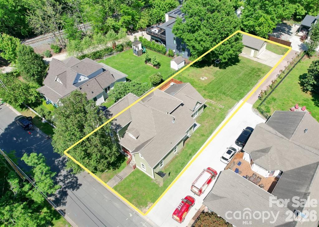 Located in the heart of highly sought-after NoDa, this 3-bedroom, 3.5-bath home offers the perfect combination of modern comfort, functional design, and unbeatable location. Situated on a quiet street just three blocks from NoDa’s popular restaurants, breweries, shopping, entertainment, and light rail access, this home provides walkability while maintaining privacy and tranquility.   PLEASE TAKE A LOOK AT THE LONG LOT SIZE THAT THE NEXT BUYER COULD BUILD A POOL OR POSSIBLY AN ADU TO ADD ADDITIONAL VALUE SINCE THIS IS ONE OF THE LARGEST LOTS IN THE IMMEDIATE AREA.
Inside, you’ll find soaring ceilings, abundant natural light, and an open-concept layout designed for everyday living and entertaining. The custom kitchen features quality finishes, ample cabinetry, and seamless flow into the main living spaces. Each spacious bedroom includes its own private en-suite bathroom, offering comfort and convenience for guests or family members.
The oversized primary suite is a true retreat with vaulted ceilings, a large walk-in closet, and built-in storage solutions. Outdoors, enjoy the large flat lot and fully open backyard complete with an expansive deck ideal for hosting gatherings, grilling, or relaxing.
A MASSIVE detached two-car garage provides exceptional storage space and flexibility.  The garage fits 2 full sized vehicles and still has extra space for for a workshop.