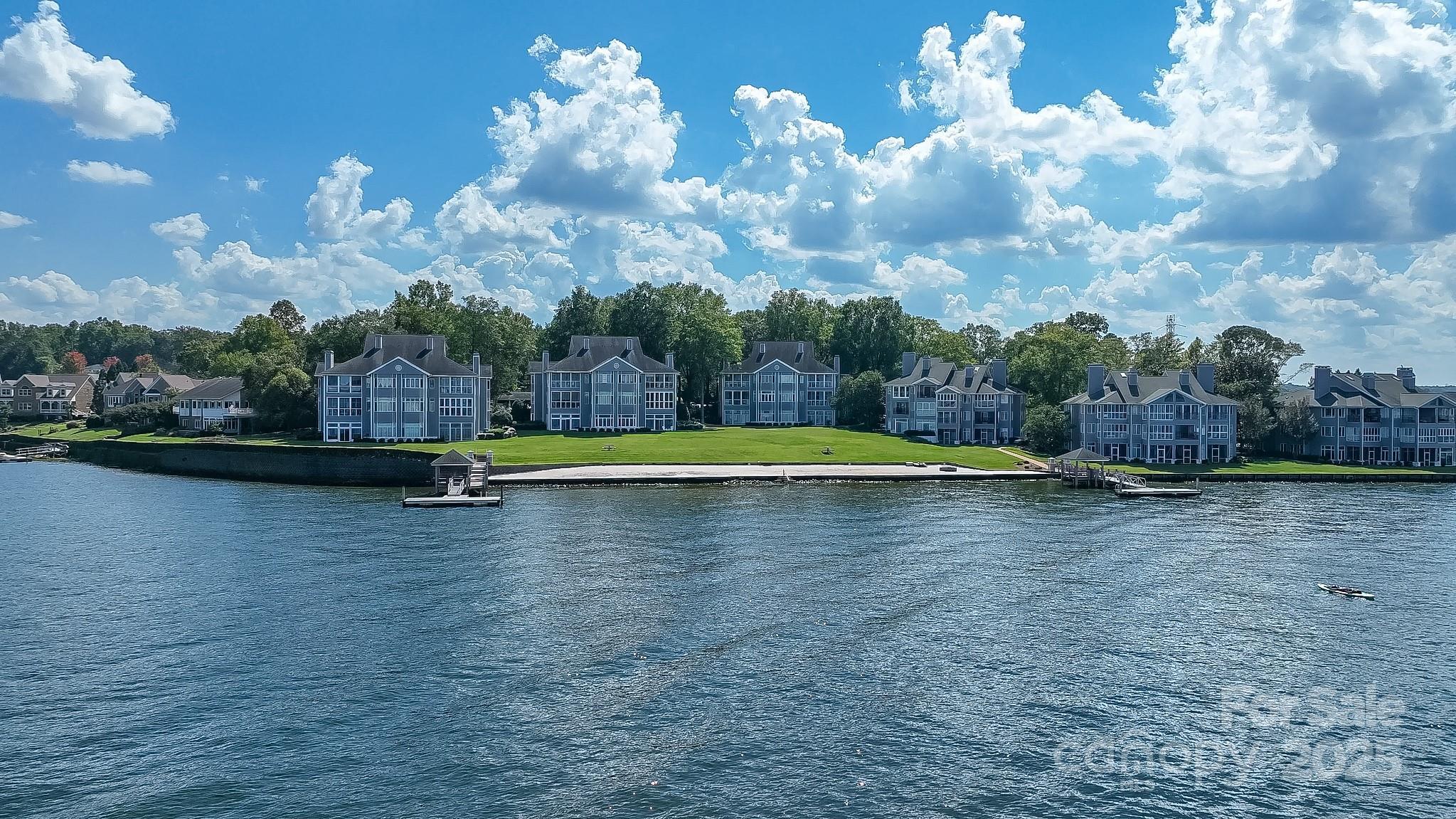 ENJOY RESORT STYLE LIVING w/Fabulous Amenities Minutes from Charlotte! RARE OPPORTUNITY for LONG-RANGE, MAIN CHANNEL WATERFRONT VIEWS. One Level Living... No Interior Steps! Relax w/Cool Breezes & Sounds of Water from Crank Out Windows! 3 Bedrooms, 3 Full Baths + Sunroom off Primary Bedroom + Covered Porch at Family Room. Kitchen Features Solid Surface Countertops, Raised Breakfast Bar w/Seating in Addition to Casual Dining Area. Great Room w/ Gas Fireplace Opens to Porch & Boasts Stunning Views of Lake Wylie! NEW HVAC SYSTEM (2024). Private, Walk-In Storage Room Located Next to Front Door. Neighborhood POOL, TENNIS, PLAYGROUND-slide/swings/seasaw/climb, BEACH, Firepit, DAY-DOCKS, Multiple GRILLS, Picnic & Recreation Spaces!!! HOA Cookouts, Social Gatherings & Celebrations! No Maintenance Living & Outdoor Amenities to Delight ALL AGES!!! HOA Rents Limited Storage Spaces for Boat-JetSki-Kayak Trailers. MARINA Next Door Rents Slips. Backyard view up the lake is nearly 2 miles... WOW!!!