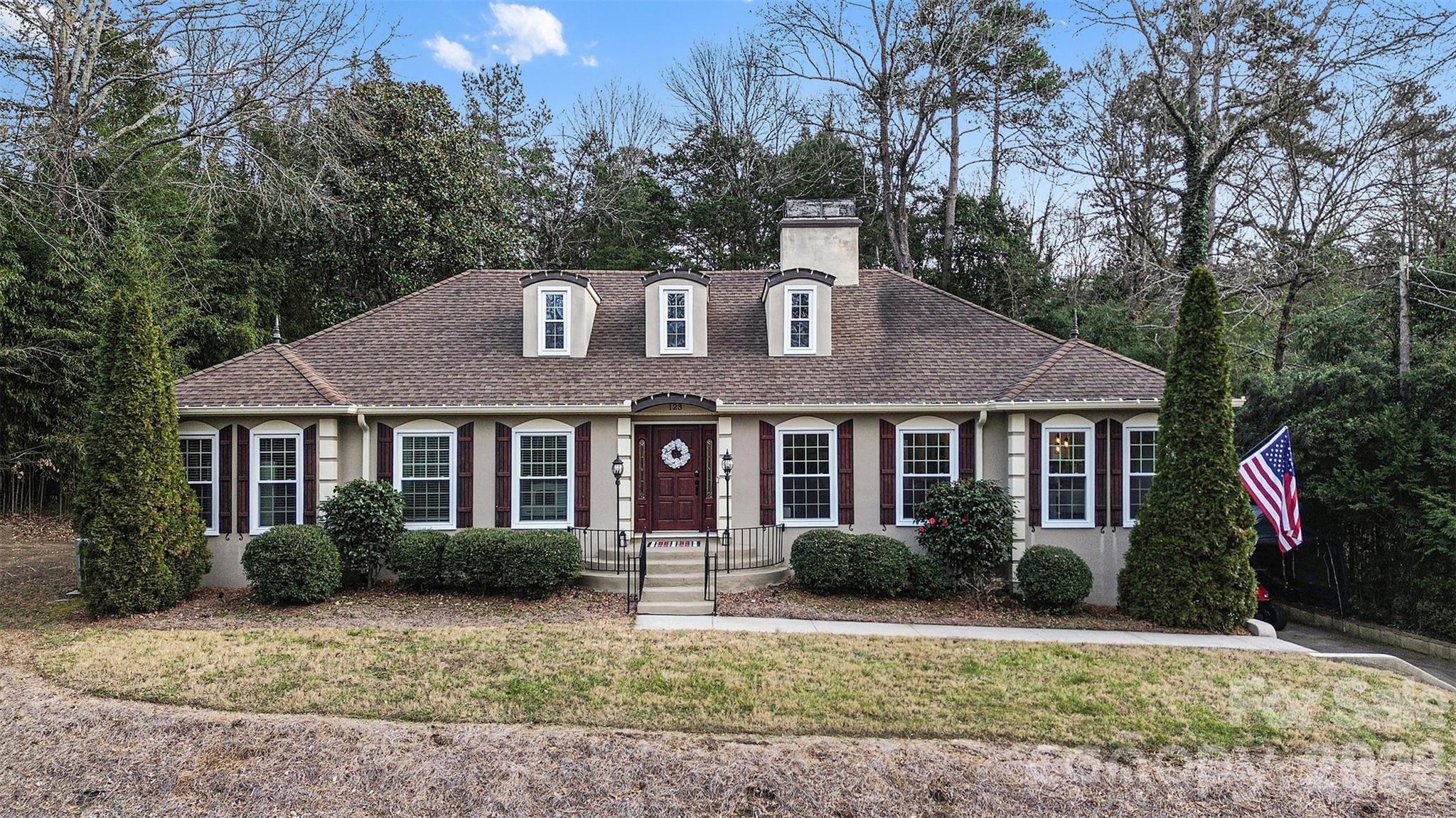 Welcome to this rare, privately gated retreat on nearly 1 acre with NO HOA, offering exceptional privacy just minutes from SouthPark and Uptown Charlotte. Behind a new electric gate, this beautifully updated home sits on a fully fenced, landscaped lot with room for a future pool. Enjoy outdoor living on the new 60' x 14' patio with a custom fire pit.

Inside, hardwood floors, loads of windows, and multiple living areas create a bright, inviting atmosphere. The gourmet kitchen features granite countertops, stainless steel appliances, and soft-close custom cabinetry. The main level also features  living, family and dining rooms that flow seamlessly into each other, a spacious primary suite with dual walk-in closets and backyard access, plus two secondary bedrooms.

The finished lower level offers a large bonus living area, private bedroom and bath, flex room, and separate entrance—ideal for guests, in-laws, or multigenerational living. A two-car garage with a heated/cooled workshop adds even more versatility.

Additional features include a walk-in attic with expansion potential, upgraded electrical with whole-home GFI protection, and a prime location near top private schools, the McAlpine Creek Greenway, SouthPark shopping, dining, and places of worship.

A rare opportunity to own a private estate that perfectly blends space, privacy, and convenience in one of South Charlotte's most desirable locations.