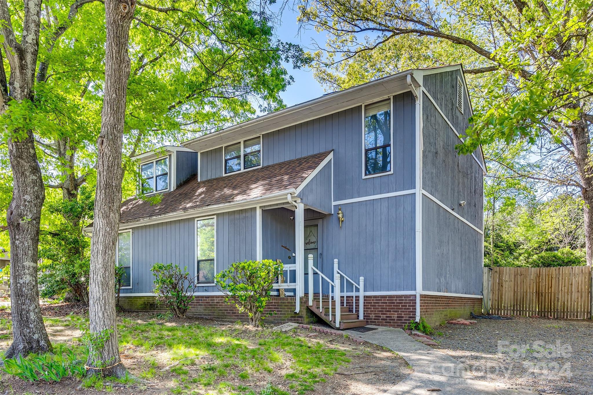 Step into this inviting home featuring fresh interior paint and a beautiful updated kitchen complete with a cozy breakfast nook. The open living room features a fireplace that flows into the dining area. The laundry room is conveniently located on the first floor. Upstairs, you'll find two bedrooms, each accompanied by its own full bathroom for added comfort and privacy. Outside, the spacious fenced backyard on a corner lot offers ample room for relaxation and entertainment, all with NO HOA. Conveniently located near Carolina Place Mall, Atrium Health Pineville, and I485. Make it yours today!