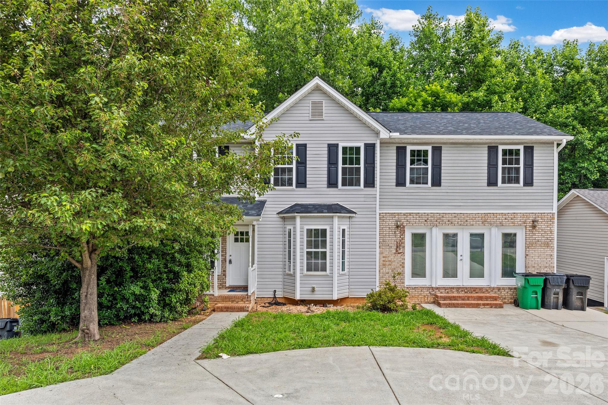This spacious 4-bedroom, 3.5-bath home with a basement offers an incredible amount of living space, unique architectural details, and endless potential.  The main level features granite countertops, stainless steel appliances, an island kitchen, and a bedroom that is perfect for guests, a home office, or multigenerational living. Throughout the home, you'll find extensive tilework and laminate flooring.  Upstairs, the oversized primary suite serves as a true retreat, featuring a stunning spa-inspired bath with dual vessel sinks, a freestanding soaking tub, vaulted ceilings, and abundant natural light.  The walk-out basement offers unlimited possibilities for future expansion, recreation, a home theater, gym, workshop, or additional living space.  Outdoor living is just as impressive with two decks—one off the main level and another private deck accessible from the primary suite—overlooking the fenced backyard. Additional highlights include a distinctive circular driveway.  Homes with this combination of space, flexibility, and value don't come along often.  Home is being sold as-is.