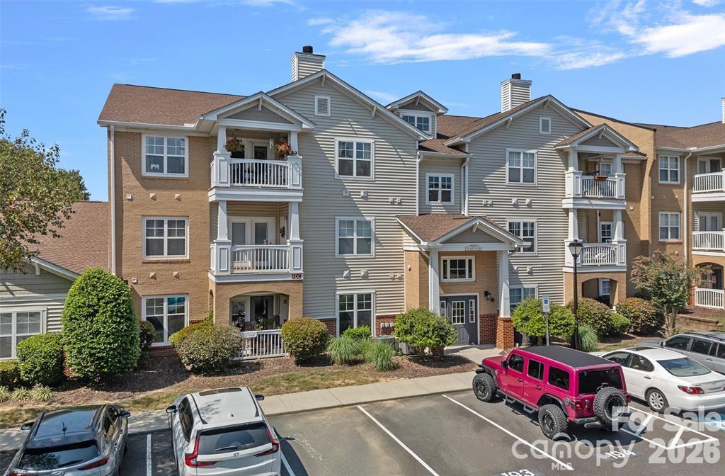 GARAGE INCLUDED! Discover this beautifully maintained second-level condo in the highly sought-after Copper Ridge community! This spacious two-bedroom, two-bath unit also includes a versatile office/den. The open floor plan welcomes you with a bright and airy living room that seamlessly connects to the dining area, accented by elegant moldings. The kitchen boasts granite countertops, stainless steel appliances, and a breakfast bar, with a conveniently adjoining laundry/utility room. Enjoy a private, covered deck/balcony off the living room, complete with a spacious storage closet. A deeded one-car garage provides direct access to the building, Residents of Copper Ridge enjoy top-tier amenities such as a clubhouse, fitness center, tennis courts, and two swimming pools. This prime location offers easy access to shopping, dining, and I-485. Don't miss out on this fantastic opportunity!