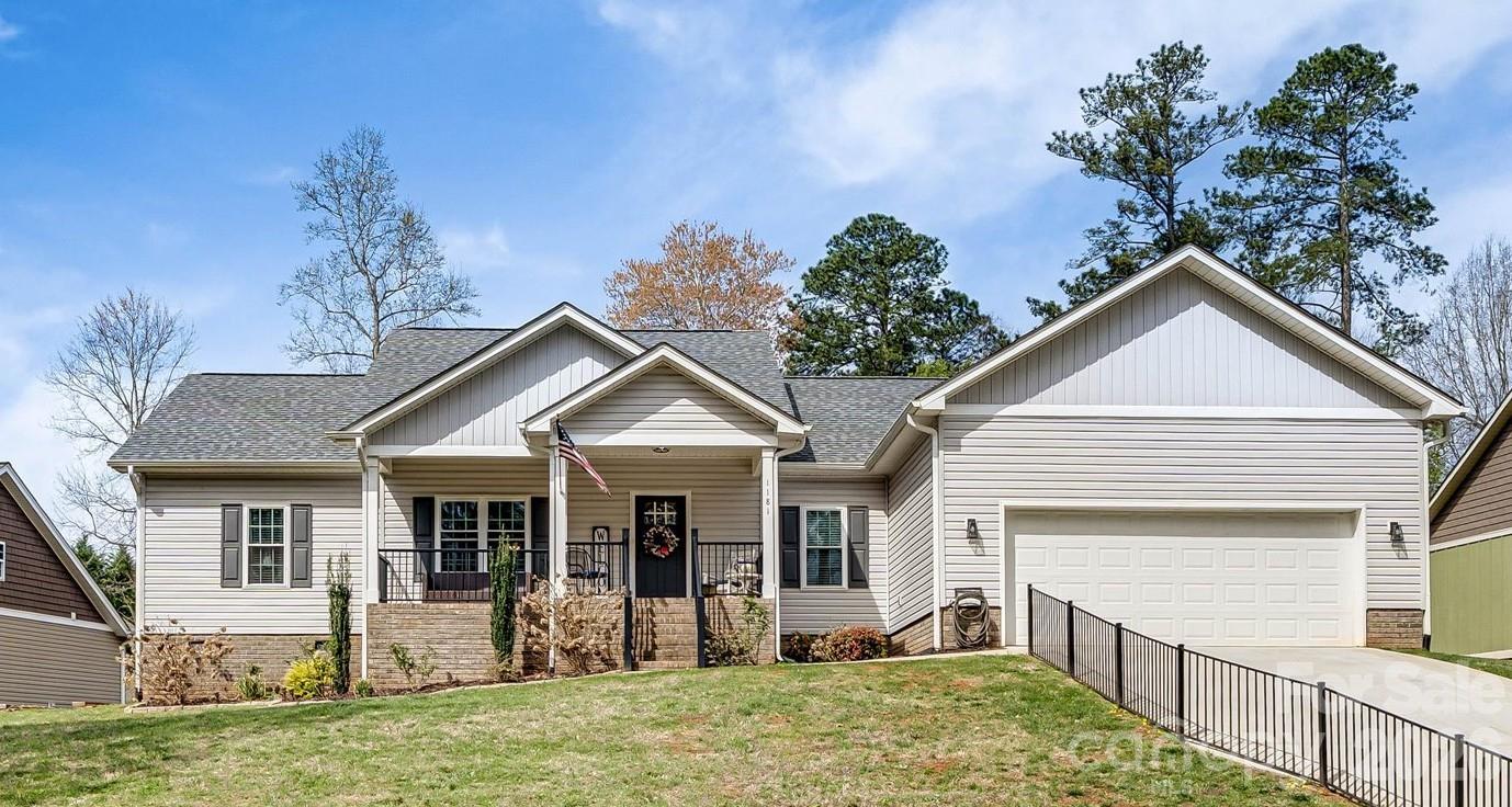 Welcome to this beautiful 3 bed/ 2 bath home nestled in the middle of the established Nottingham Estates! The open floor plan is enhanced by a vaulted ceiling in the living area and a cozy, gas fireplace with a custom mantle.  The split bedroom layout ensures added privacy in the spacious primary suite complete with a walk-in closet, tiled shower with glass enclosure and a freestanding soaking tub.  Two nice sized bedrooms flank the other full bath on the opposite side of the home with the kitchen and living area in between. Additional highlights include: hardwood floors in the main area, stainless appliances, custom cabinetry, granite countertops, an attached two car garage, which was built deeper than average, with attic storage above,  Rinnai water heater, designated laundry room with cabinetry, a covered front porch and a back patio that was converted into a deck with Trex decking and a Sunsetter cover to provide shade on those hot, sunny days overlooking the beautiful fenced in back yard. This home blends style, comfort and functionality in a quiet and desirable community.