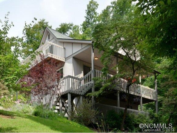 Beautifully maintained home tucked away in a sweet neighborhood in Reems Creek. Large covered front porch(one of four) leads you to the front door opening to a foyer. To the right of the entry is open dining & kitchen while to the left is the private living area w/gas fireplace & mountain views and a full bath. Upstairs 3 private bedrooms, 2 w/private sitting porches & full bath complete this exceptional home. Eligible for 100% USDA financing.