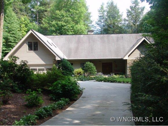 Custom Built and lovingly maintained, this home sits ona large, private, lake-front lot with exceptioanl terrain. A stone walkway leads to the existing dock and large boathouse.Ownership entiltles application to Lake Toxaway Country Club. Enjoy Western NC's largest, private, recreational lake and all the ammenities this "seasoned community" has to offer!