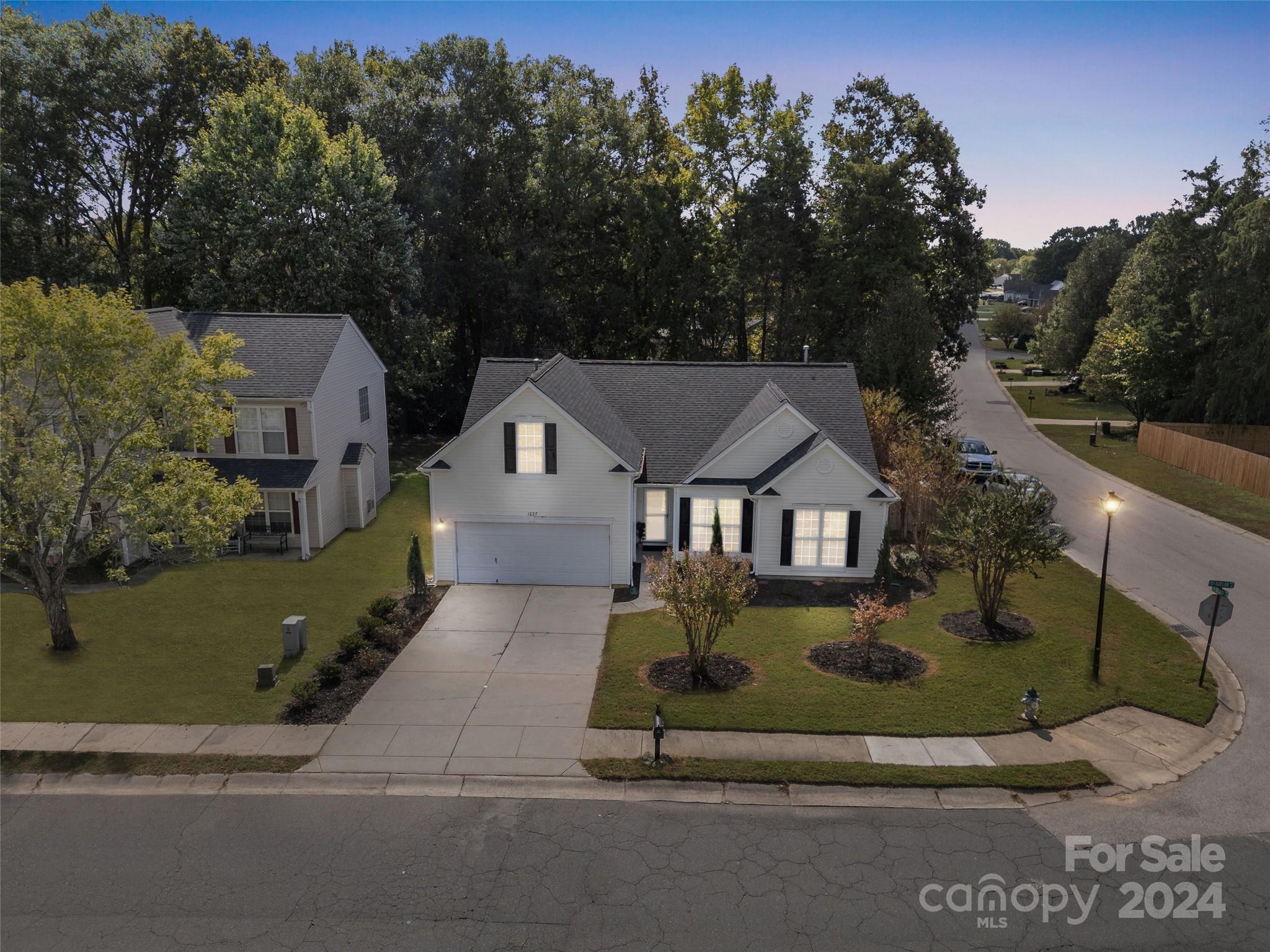 Welcome home to this perfectly renovated 1.5 story bungalow. All you need to do is pack your bags as everything else has been done for you! Fresh and modern paint throughout, completely renovated primary bath, and updated guest bath. Enjoy the custom trim work in the office, the high ceilings, the spacious kitchen, and multi-purpose bonus room above the garage. Step out into your backyard paradise complete with fruit trees, a brand new privacy fence, and extensive landscaping. NEW roof!