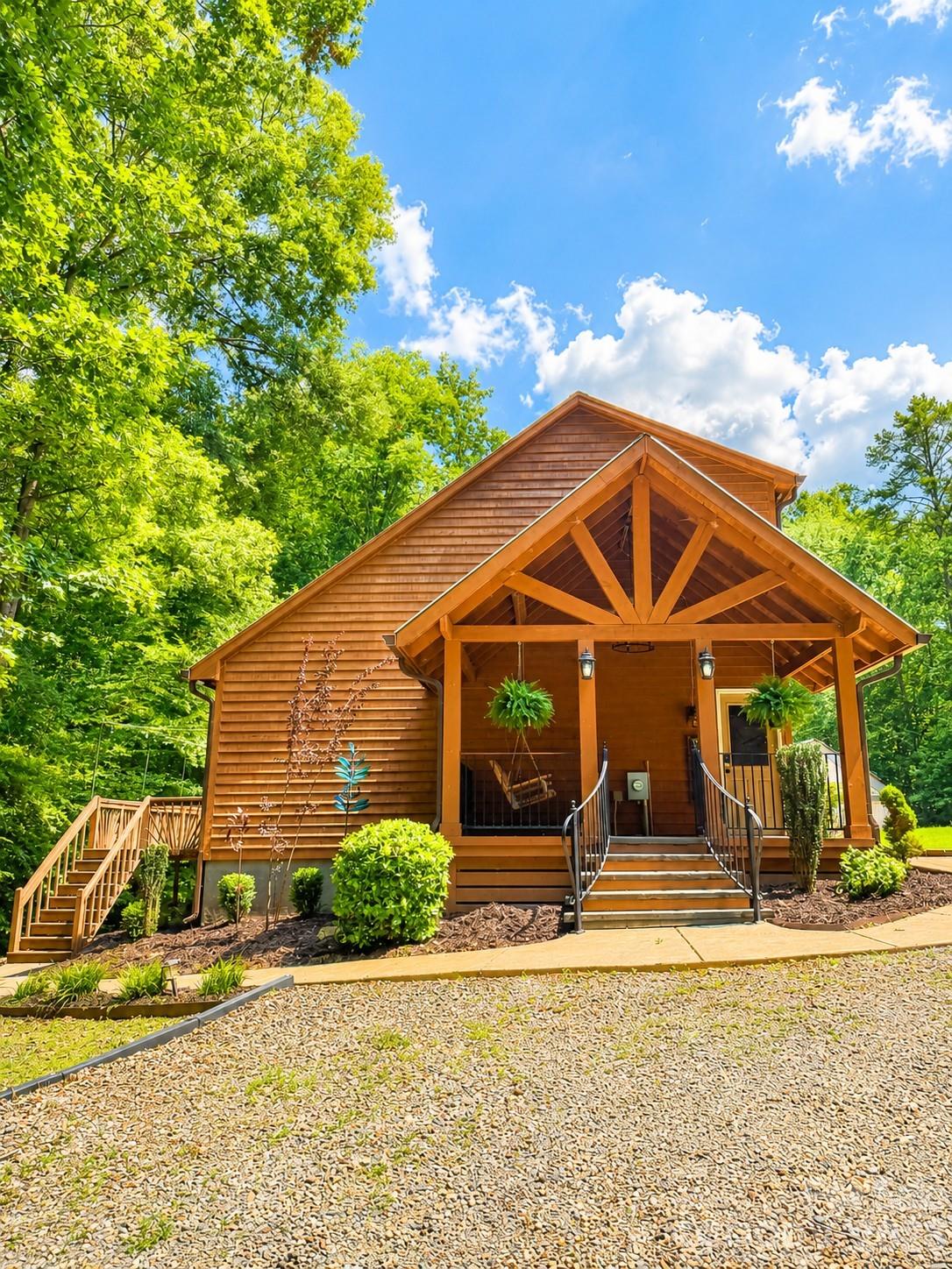 Escape to your own private retreat at 5814 Lakeway Trail, Waxhaw, NC. Nestled on 8 picturesque acres, this one-of-a-kind property offers the warmth and character of a log cabin tucked among the trees, creating a peaceful setting where nature and comfort come together.

Inside, the inviting open-concept floor plan is designed for both everyday living and entertaining. The spacious great room flows seamlessly into the kitchen and dining areas, while windows bring the beauty of the surrounding landscape indoors. The primary suite is conveniently located on the main level, providing privacy and easy accessibility.

Step outside and experience all this remarkable property has to offer. Explore private trails winding throughout the acreage, enjoy the serenity of the wooded surroundings, or take advantage of the property's proximity to Cane Creek Park, where outdoor recreation is just minutes away. Whether you enjoy being outside for adventures, or simply relaxing in nature, this location is a dream for outdoor enthusiasts.

An oversized wired shop provides exceptional space for hobbies, woodworking, storing equipment, or running a home-based business, making this property as functional as it is beautiful.

Offering the rare opportunity to live, work, and play on your own private estate while still being convenient to the charm of Waxhaw, 5814 Lakeway Trail is more than a home—it's a lifestyle. If you've been searching for a peaceful woodland retreat with room to roam, this extraordinary property is ready to welcome you home.
