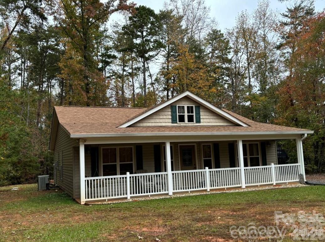 Experience the perfect blend of modern comfort and natural beauty in this beautifully updated 2-bedroom, 2-bath bungalow within the gated Carolina Forest community. Recent upgrades including a recently replaced roof, new siding, granite countertops, and updated appliances ensure a move-in-ready experience. Situated on a private, level lot, this home offers easy access to the serene waters of Lake Tillery and the expansive trails of the Uwharrie National Forest. Sold partially furnished for your convenience, this turn-key retreat is an incredible opportunity to enjoy peaceful living in a prime location.
