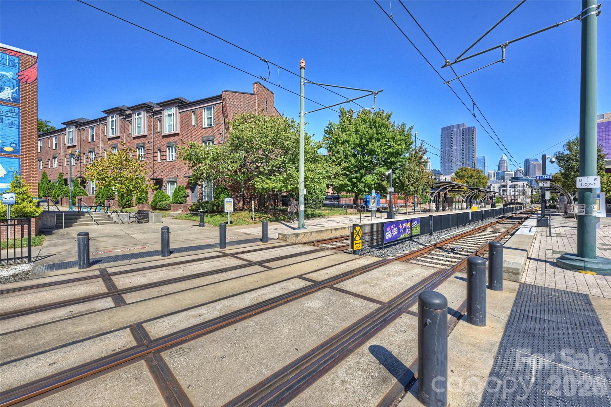 1425 Camden isn’t just near South End.

It lives inside the rhythm of it.

Rail Trail mornings.
Coffee runs that somehow turn into lunch.
Breweries filling up by late afternoon.
The skyline changing almost monthly around you.

And from this location, you can walk to all of it.

Positioned just steps from the Bland Street Light Rail stop and directly connected to the energy of South End, this all-brick end-unit townhome offers something many buyers spend years renting in the neighborhood searching for:

Space.
Privacy.
Ownership.
And the ability to stay connected to the lifestyle without sacrificing how you actually live day to day.

Natural light pours through expansive windows across multiple levels, while Uptown skyline views and several outdoor living spaces create the kind of urban experience people move to South End hoping to find.

Inside, the main living level feels open, bright, and naturally connected.

Updated wood flooring.
Large gathering spaces.
Seamless flow between kitchen, dining, and living areas.
Two private balconies overlooking the movement and energy of the neighborhood below.

The kitchen features stainless KitchenAid appliances, granite countertops, recessed lighting, and generous prep space designed for real everyday living — not just quick visual impact.

Upstairs, both bedrooms feature updated ensuite baths, while the entry-level third bedroom with full bath creates flexibility for guests, office space, gym setup, or roommate living.

And unlike many South End properties that prioritize density over functionality, this home actually lives comfortably.

Attached garage.
Additional storage.
Low HOA.
True lock-and-leave convenience.

And perhaps most importantly:
when you step outside, South End immediately starts happening around you.

Restaurants.
Breweries.
Fitness studios.
Coffee shops.
Light Rail access.
Uptown connectivity.
The Rail Trail just outside your door.

For buyers ready to level up from apartment living without leaving behind the energy that brought them to South End in the first place, this is exactly where that next chapter starts.