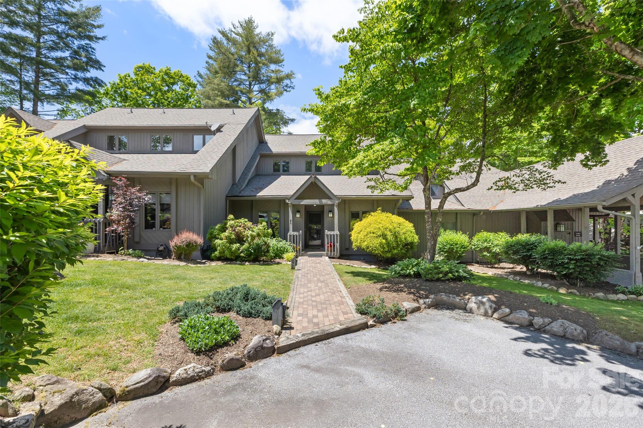Discover the incredible potential of this spacious condominium, ideally situated in one of Burlingame’s most desirable settings. Overlooking the newly restored 10th fairway, the property enjoys sweeping golf course views with glimpses of Lake Soquilla and the surrounding mountains beyond. The scenery is peaceful and picturesque year-round, best enjoyed from the inviting screened porch just off the main living area.  Inside, generous living spaces and a warm wood-burning fireplace create the perfect foundation for a beautifully renovated mountain retreat tailored to your personal style. The floor plan includes three bedrooms, each with its own ensuite bath, while the finished walk-out lower level offers a versatile flex room, half bath, and a small workshop area. A covered patio opens directly onto the golf course, creating seamless indoor-outdoor living.  One of the unique advantages of this residence is the ability to keep your golf cart conveniently covered beneath the rear deck, allowing quick and easy access to the course.  Located just a short walk from the clubhouse, tennis courts, and pickleball facilities, this property offers exceptional convenience for those who choose to join the Burlingame Country Club. Fairway Villas is an intimate community of just thirty condominiums with an active and welcoming residential atmosphere. A 30-day minimum rental policy helps preserve the peaceful character of the neighborhood.  Combining outstanding views, an unbeatable location, and endless renovation potential, this property is a rare opportunity to create a spectacular golf and mountain retreat.