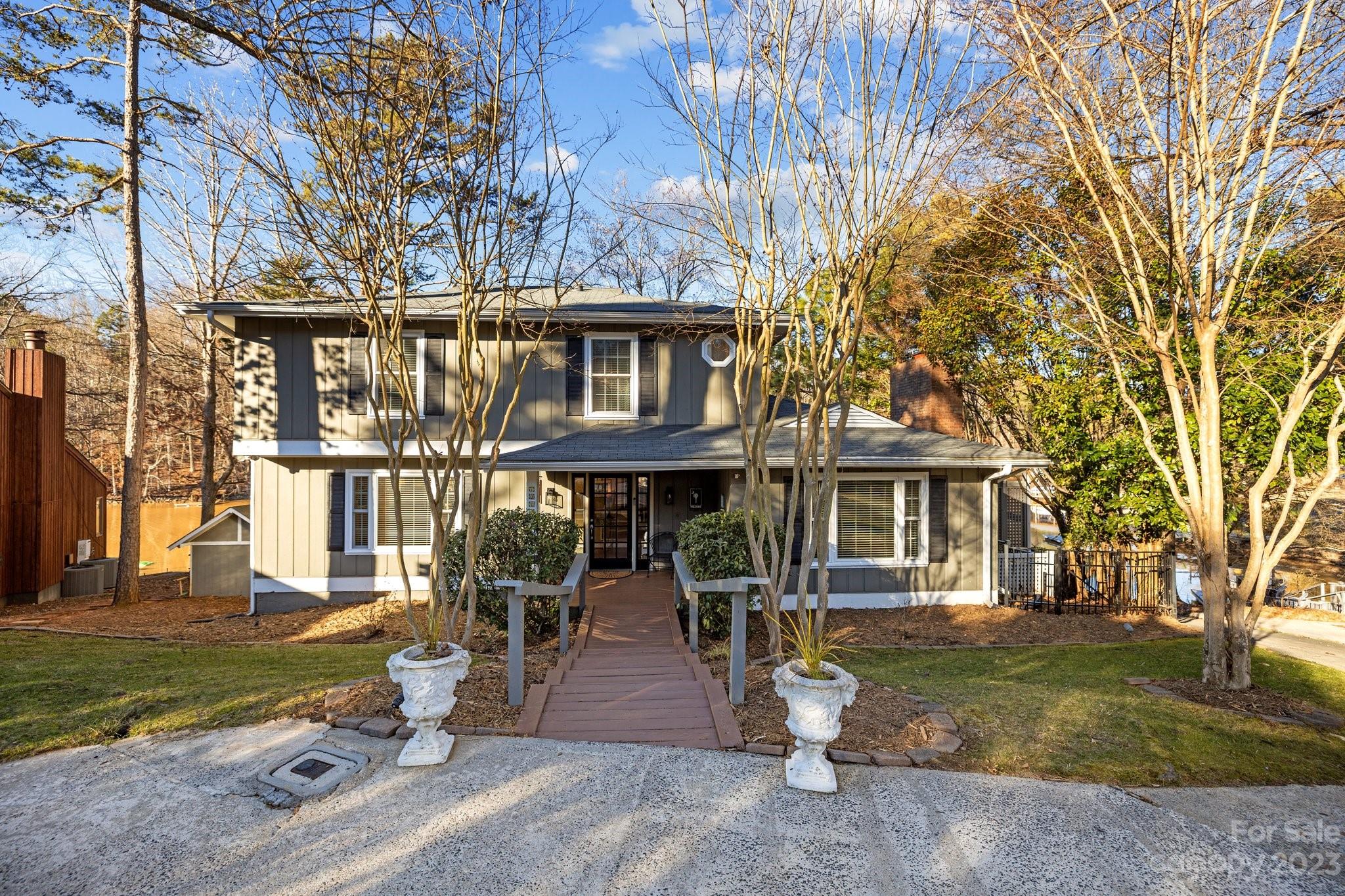 This beauty is back!  No fault to the sellers!  Homes Foor You presents...
Nestled in the charming community of Tega Cay, this exquisite lakefront property offers a serene retreat w/ unparalleled waterfront views. Step inside to discover a remodeled kitchen featuring high-end appliances, sleek countertops, & ample storage space. Imagine preparing meals while gazing out over the tranquil waters, creating a truly picturesque experience. Main level includes an office, family room, dining room, powder room & laundry room plus 2 pantries. Upstairs, you will find 4 bedrooms & 2 full bathrooms.  The custom outdoor kitchen and entertaining area with fire pit and “bar” area complete this dream location. Boating enthusiasts will appreciate the private dock, offering direct access to the lake for water activities and exploration.  Great for kayaking, paddleboarding, or simply enjoying the gentle lapping of the waves on the private beach area. BE SURE TO ASK ABOUT THE LIST OF ADDITIONAL FEATURES.
