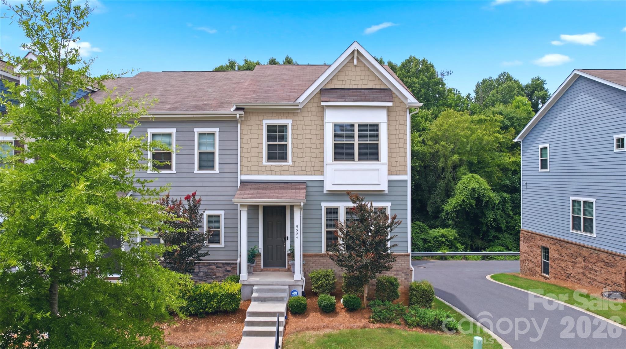 Welcome to 9524 Ainslie Downs Street in Charlotte, NC—a beautifully maintained end-unit townhome offering the perfect combination of modern design, flexible living space, and everyday convenience. Backing to mature trees for added privacy and peaceful views, this practically new 4-bedroom, 3.5-bath home delivers low-maintenance living in one of Charlotte's most convenient locations.

Step inside to discover a bright, open-concept floor plan designed for today's lifestyle. The main living level features engineered hardwood flooring, abundant natural light, and seamless flow between the living, dining, and kitchen spaces—ideal for entertaining, working from home, or simply enjoying everyday life.

The chef-inspired kitchen is the heart of the home, showcasing quartz countertops, stylish gray cabinetry, a large center island with seating, subway tile backsplash, and a gas range with double ovens. Whether preparing weeknight meals or hosting guests, this kitchen offers both functionality and style.

Enjoy access to community amenities including a pool, cabana, and grilling area—perfect for relaxing and socializing close to home.

Conveniently located in Southwest Charlotte, this home offers easy access to Charlotte Douglas International Airport, Uptown Charlotte, the LYNX Blue Line light rail, major highways including I-485 and I-77, shopping, dining, entertainment, healthcare facilities, and everyday conveniences.

If you're searching for a move-in ready townhome in Charlotte with a guest suite, modern finishes, wooded views, and exceptional convenience, 9524 Ainslie Downs Street deserves a spot at the top of your list.

Schedule your private tour today and experience all this exceptional Charlotte townhome has to offer.