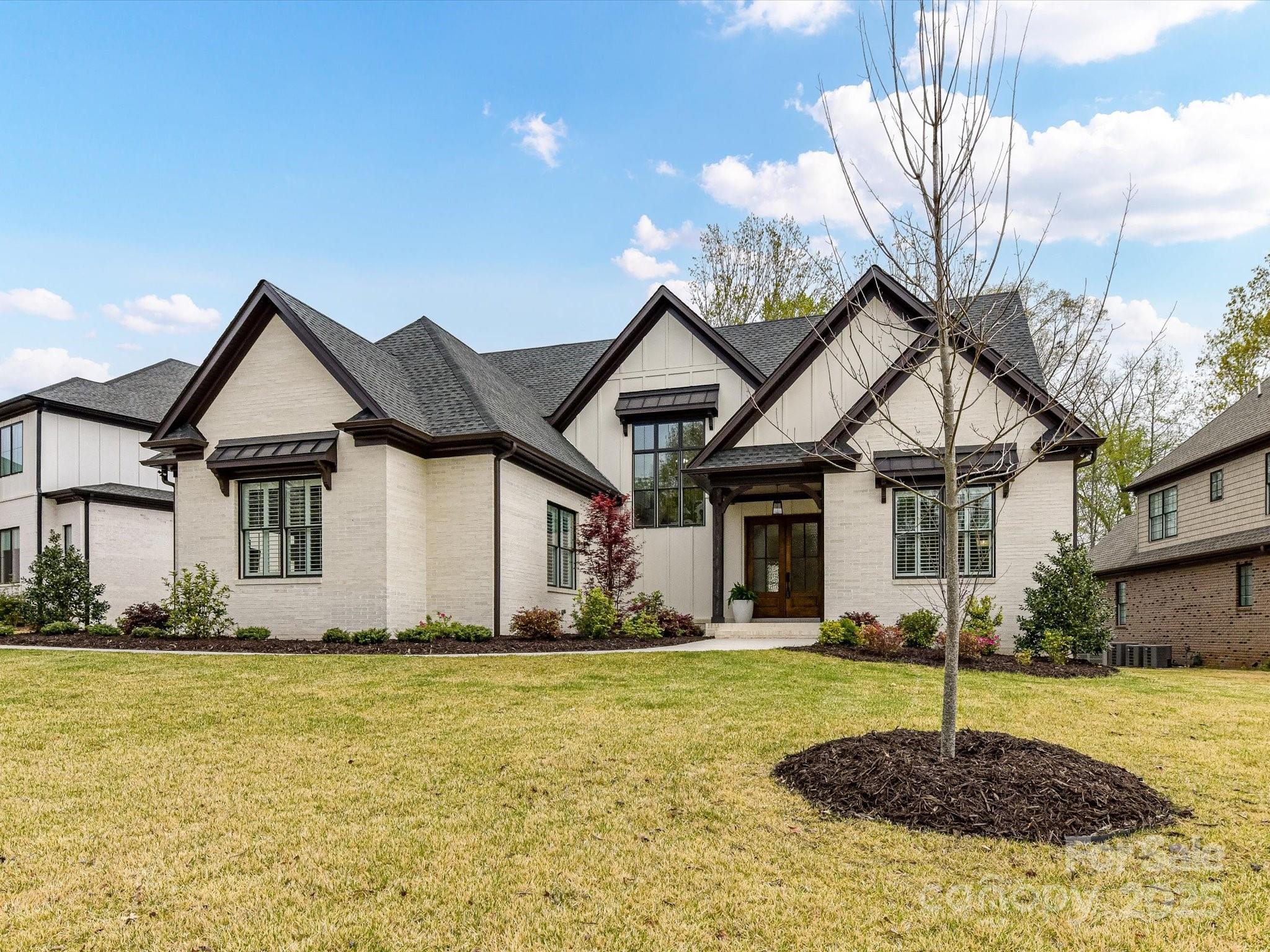 Exquisite custom-built home on private lot in sought after Fort Mill.  Every detail in this home has been thoughtfully laid out and sure to impress the most discerning buyer.  The luxurious high-end kitchen is equipped with every modern convenience and top of the line features.  The home's inviting open floor plan features rich wood beams, a custom mantle and shiplap that surrounds the fireplace and overlooks the serene, private wooded backyard.  The stunning and spacious screened porch features a soaring cathedral ceiling, a gas outdoor fireplace framed by floor-to-ceiling tile, and the perfect blend of comfort and elegance. An elegantly designed master bathroom boasts a spacious shower with an overhead rain feature, multiple showerheads and a custom walk-in closet for ultimate luxury and convenience.   Plenty of storage in the home and all bedrooms offer walk in closets.  Fort Mill Schools. Community pool, clubhouse and playground.  Don't miss this spectacular home!