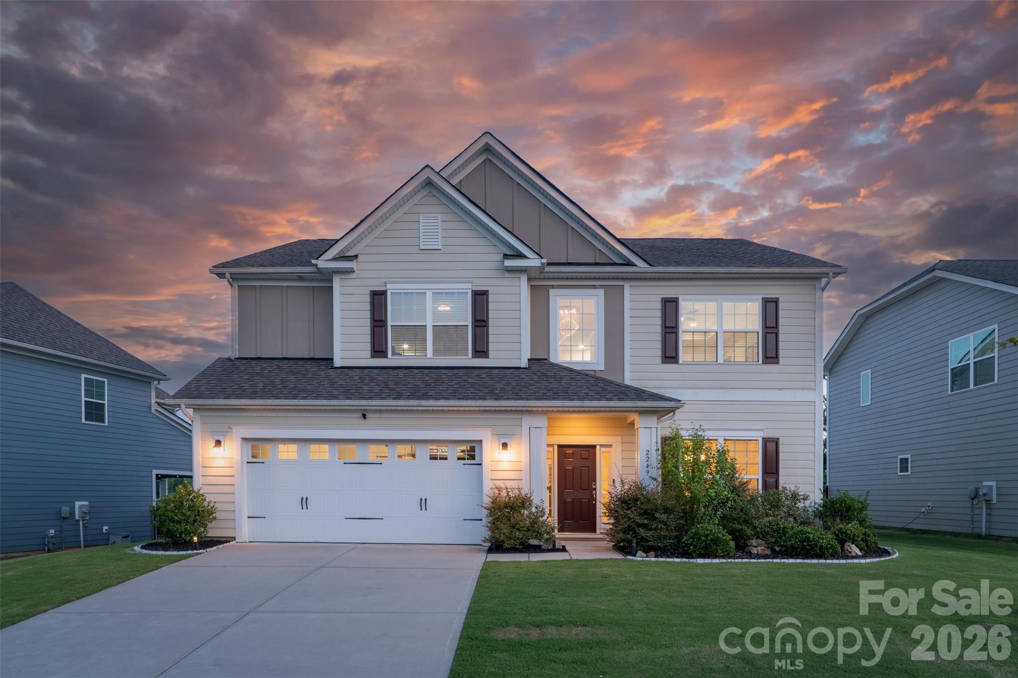 Move-in ready and beautifully appointed, this 4-bedroom, 3-bath home is nestled in the highly sought-after Covington community, just minutes from Charlotte’s desirable Ballantyne area, known for its premier shopping, dining, and convenient access to major highways. A dramatic two-story foyer welcomes you into a thoughtfully designed floor plan featuring wide-plank wood flooring and a timeless neutral palette throughout. The spacious dining room is ideal for hosting family and friends, while the chef-inspired kitchen is the heart of the home with white cabinetry, wall ovens, gas cooktop with vented hood, stainless steel single bowl sink, oversized island with seating, sunlit breakfast area, and generous pantry. The main level also offers a comfortable family room with a gas fireplace and a private guest bedroom with access to a full bath. Step outside to the patio and covered gazebo, creating the perfect setting for morning coffee or evening unwinding. Upstairs, the primary suite serves as a true retreat, featuring a tray ceiling, expansive walk-in closet, and spa-like en suite bath with an impressive custom-tiled walk-in shower and dual-sink vanity. An oversized loft provides exceptional flex space for recreation, entertaining or a media room. Two additional bedrooms, another full bath, and a conveniently located laundry room complete the second level. Voice and tech enabled lights in kitchen, family room and front patio. Covington residents enjoy wonderful amenities, including a community pool, clubhouse, and playground.