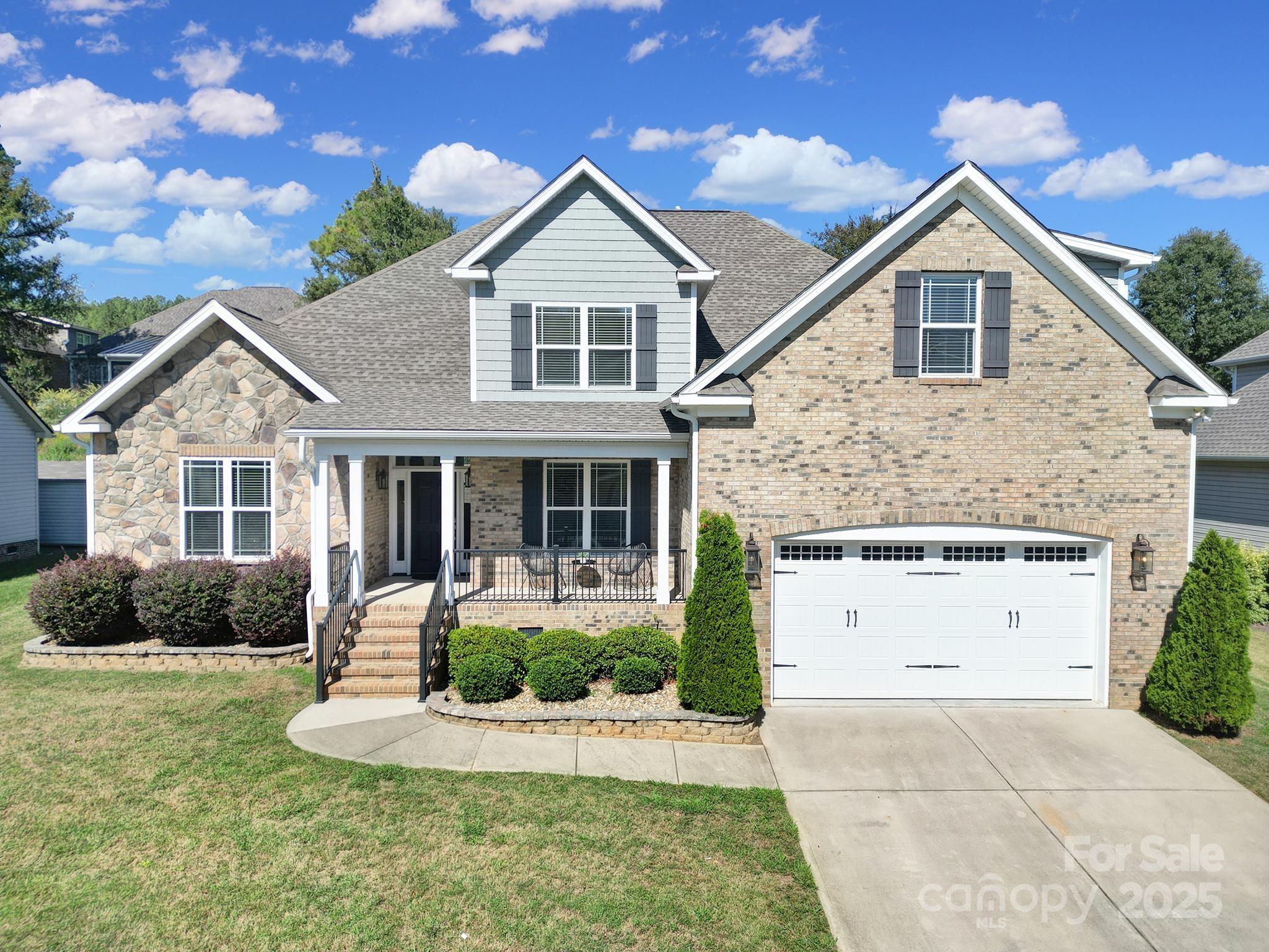 This immaculate 4 bedroom home in the popular Seven Oaks subdivision is yours for the taking! Custom-built by Alosi Builders, this home brings luxury and functional craftsmanship together in all the right ways. Step inside to find soaring 12’ ceilings in the foyer and living room, detailed wainscoting, and ¾” red oak hardwoods that carry throughout the main spaces. The entire home is freshly painted with neutral Alabaster White leaving a blank canvas for the new owner. The main floor consists of a living room centered around a gas fireplace, half bathroom, formal dining room, kitchen with breakfast nook, primary suite, and large laundry room with sink.
The kitchen consists of granite countertops, stainless steel appliances, soft-close cabinetry, and pantry. Peek out of the back door to find a deck overlooking the backyard with a private, tree-lined view atop the retaining wall. 
Upstairs, three spacious bedrooms provide plenty of room to spread out along with plenty of closet space and another full bathroom.
Take advantage of the top-notch upgrades that have been poured into the backyard with a sizable deck, custom paver fire pit with seating, a stone retaining wall with mature pampas grass for additional privacy and a partial fence that could easily be added onto to completely enclose the backyard. 
Close to restaurants, retail, and schools and easy access to I-77 and downtown Rock Hill.