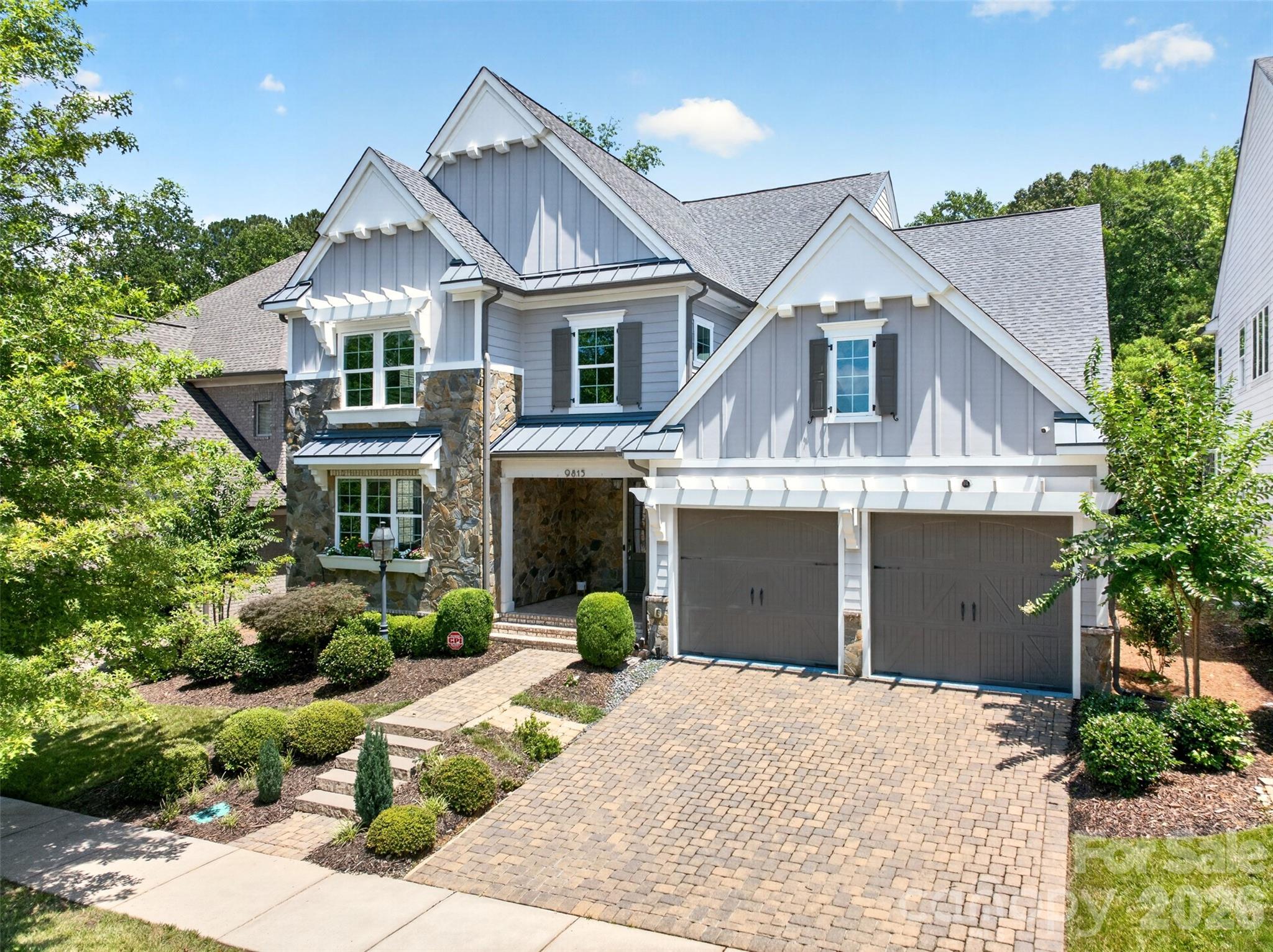 Nestled in the highly desirable Providence Retreat community of South Charlotte, this exquisite custom home built by Classica offers timeless architecture, exceptional craftsmanship, and a thoughtfully designed layout ideal for modern and multi-generational living. Ideally positioned near several of Charlotte’s premier private schools, including Charlotte Latin School, just a short 4-minute drive away, the location offers exceptional convenience for families seeking top-tier educational opportunities. Beautiful hickory hardwood floors welcome you upon entry, leading into an elegant main level featuring a private office, formal dining room, and a spacious living area filled with natural light. The open-concept design seamlessly connects the living room to the gourmet kitchen and screened outdoor porch, creating the perfect flow for everyday living and entertaining. The chef’s kitchen is a true centerpiece, showcasing stainless steel appliances, a gas cooktop with range hood, granite countertops, abundant cabinetry, designer backsplash, and an oversized island with bar seating and generous prep space. The luxurious owner’s suite on the main level features a tray ceiling, a spa-inspired bath with a large glass walk-in shower, an expansive walk-in closet, and direct access to the laundry room with double hookups for ultimate convenience. Upstairs, you’ll find a cozy loft with custom built-ins, along with two bedrooms featuring private en-suite baths and two additional bedrooms connected by a shared bathroom — offering flexibility for guests, hobbies, or growing households. Throughout the home, elegant crown molding, wainscoting details, designer lighting, and abundant storage elevate both style and functionality. Step outside to enjoy the private fenced backyard with mature privacy trees and an extra-large deck, perfect for entertaining family and friends. Additional highlights include a cobblestone driveway, covered stone and brick front porch, manicured landscaping, and epoxy floor in the garage. Enjoy the savings of an ENERGY STAR® certified home! Located just minutes from Uptown Charlotte, I-485, and South End, this home combines luxury living with everyday convenience in one of South Charlotte’s most established and sought-after neighborhoods. A must-see home that truly has it all.