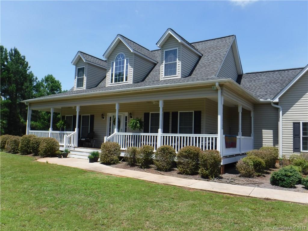 Immaculate with room to expand - 363 sq ft unfinished bonus! Spacious sun room for all to enjoy the country view! Gas log FP in GRT RM, built-ins, LG 1st floor master, HW floors (only carpet up). Nice front porch,  2 det'd storage bldgs. 34 +/- acres are planted pines - ADDED VALUE - thinned 3 yrs ago. Small creek at the back, horses welcome. Deer and turkey abound! Not all mineral rights are included in the sale (the way the seller bought it). 1 YEAR AMERICA'S PREFERRED HOME WARRANTY IN PLACE