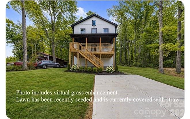Beautiful new construction home with views of Badin Lake! This 3BR/2.5BA home features an open floor plan, a spacious kitchen with a large island, wood cabinetry, and detailed trim throughout. The primary suite includes a private ensuite bath and custom closet.
Relax or entertain on the inviting front porch while enjoying views. This is not a basic build—there are numerous upgrades throughout the home.
Located near the 5,350-acre Badin Lake and Uwharrie National Forest, offering boating, incredible wildlife, and endless outdoor adventure. Ideal for full-time living, a weekend retreat, or a vacation rental opportunity.
Conveniently located near Old North State Marina for fuel and Scallywags waterfront restaurant, known for great food and live music. Don’t miss the area’s popular Fourth of July lake celebration featuring the boat parade and fireworks.
Within one hour of Charlotte and the Triad. USDA eligible, offering a potential 100% financing option. No HOA.
Photos/virtual staging are from a similar build. Professional photos coming soon.
Circle Drive public boat ramp is located nearby for easy access to the lake for your boat and water toys. Get ready to enjoy summer on the lake!  Buyers are permitted a blue-tape for touch-up items.